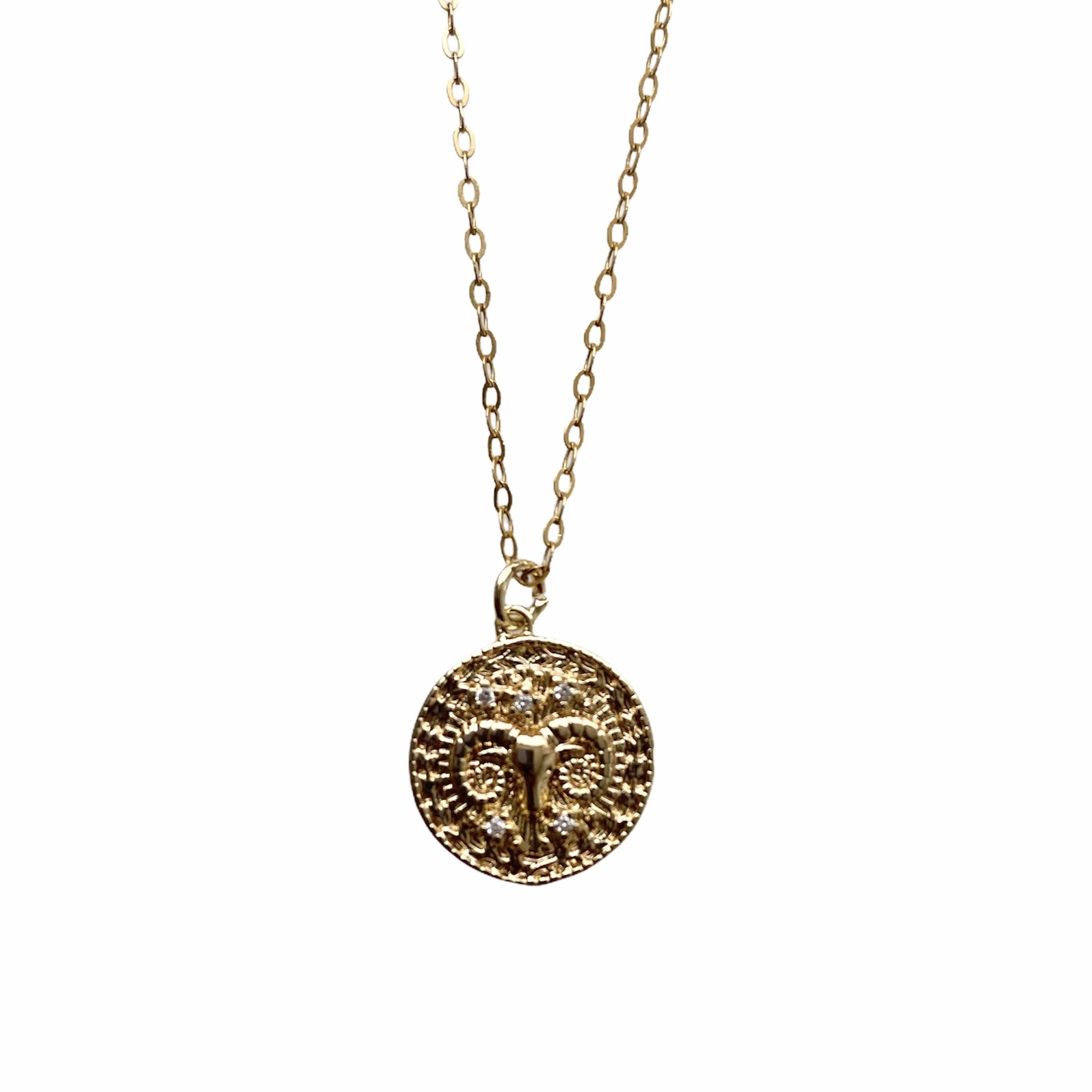 Celestial Vibes Zodiac Necklace featuring a 14K gold filled chain and zirconia encrusted pendant, elegantly displayed.