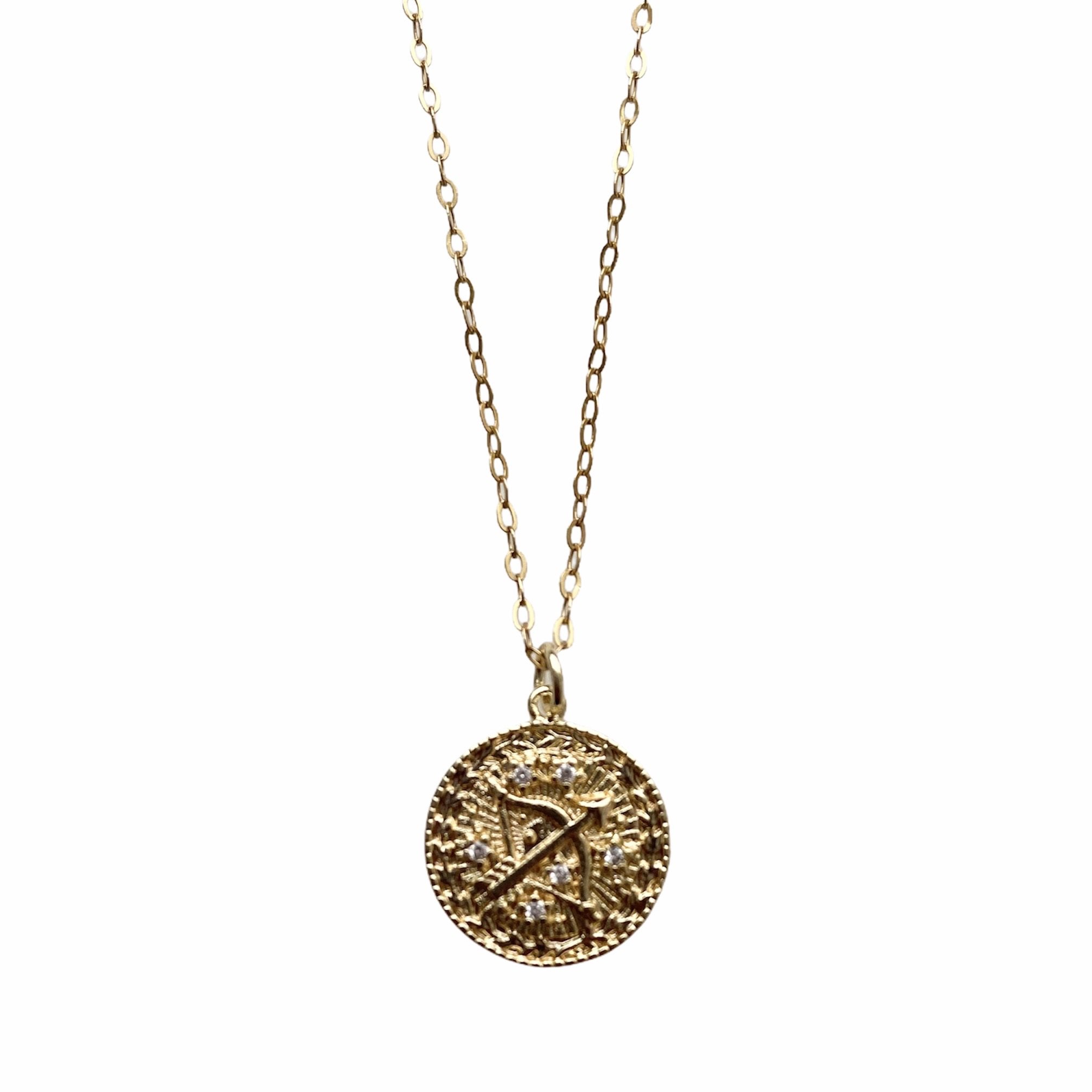 Celestial Vibes Zodiac Necklace featuring a 14K gold filled chain and zirconia encrusted pendant, elegantly displayed.