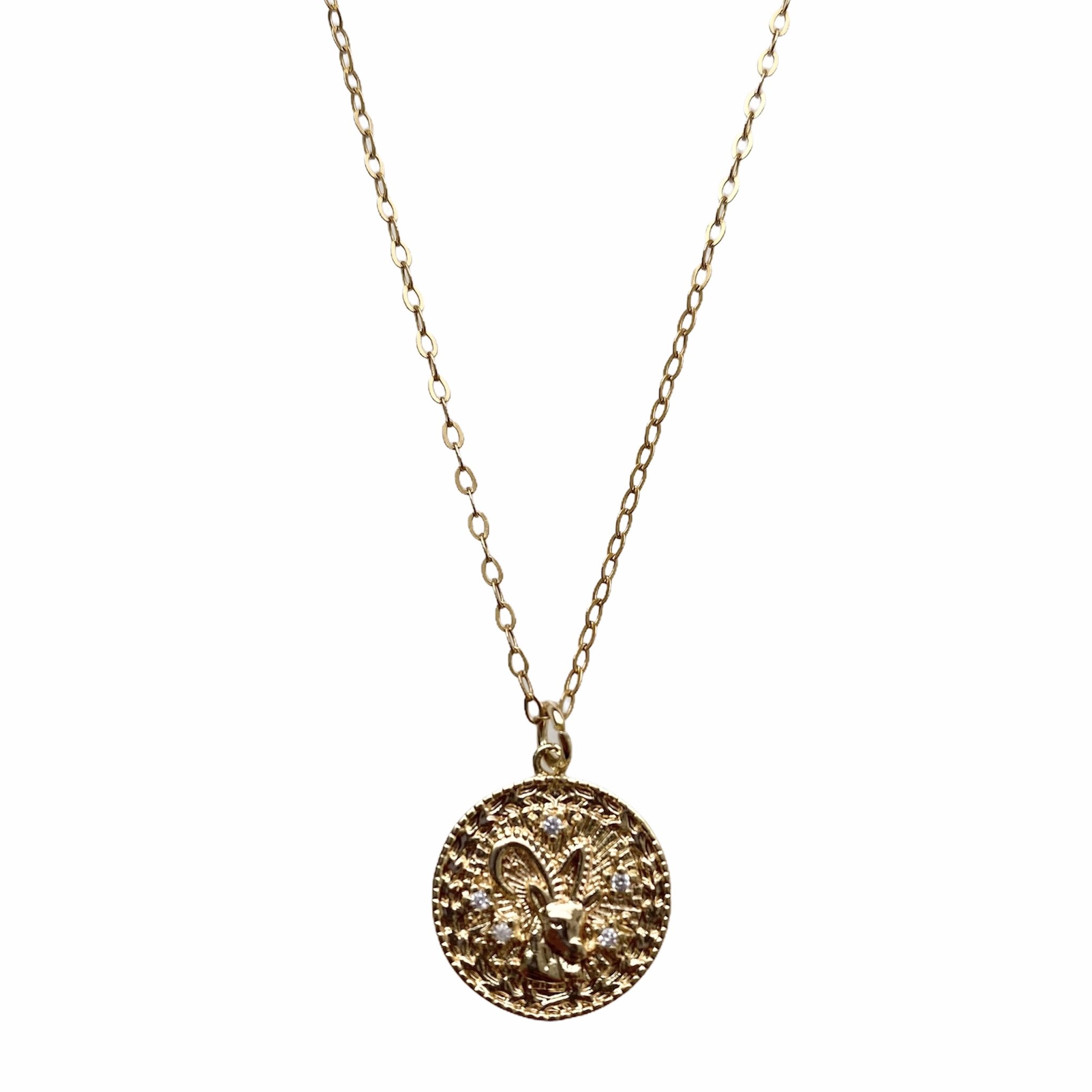 Celestial Vibes Zodiac Necklace featuring a 14K gold filled chain and zirconia encrusted pendant, elegantly displayed.