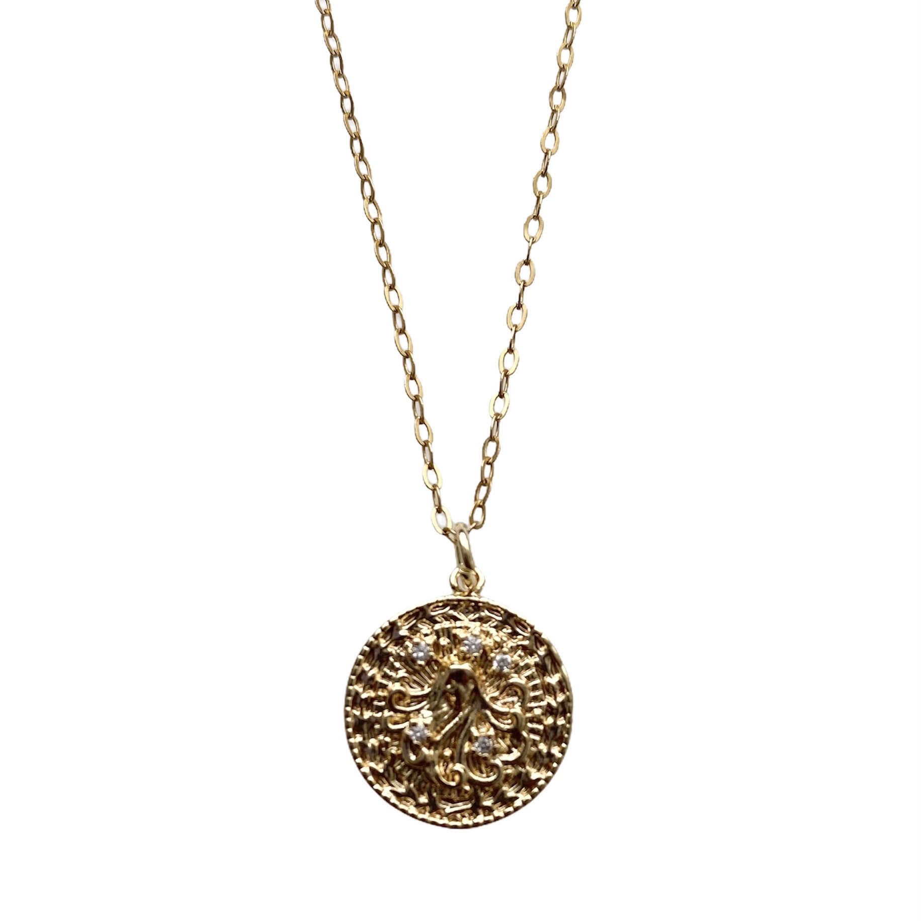 Celestial Vibes Zodiac Necklace featuring a 14K gold filled chain and zirconia encrusted pendant, elegantly displayed.