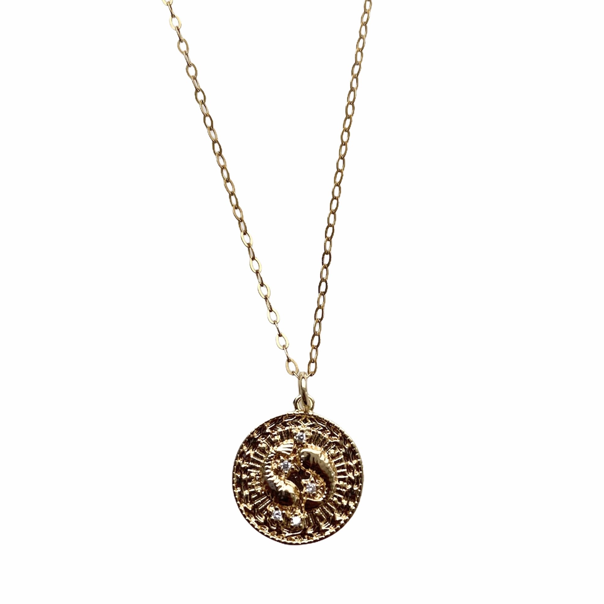 Celestial Vibes Zodiac Necklace featuring a 14K gold filled chain and zirconia encrusted pendant, elegantly displayed.