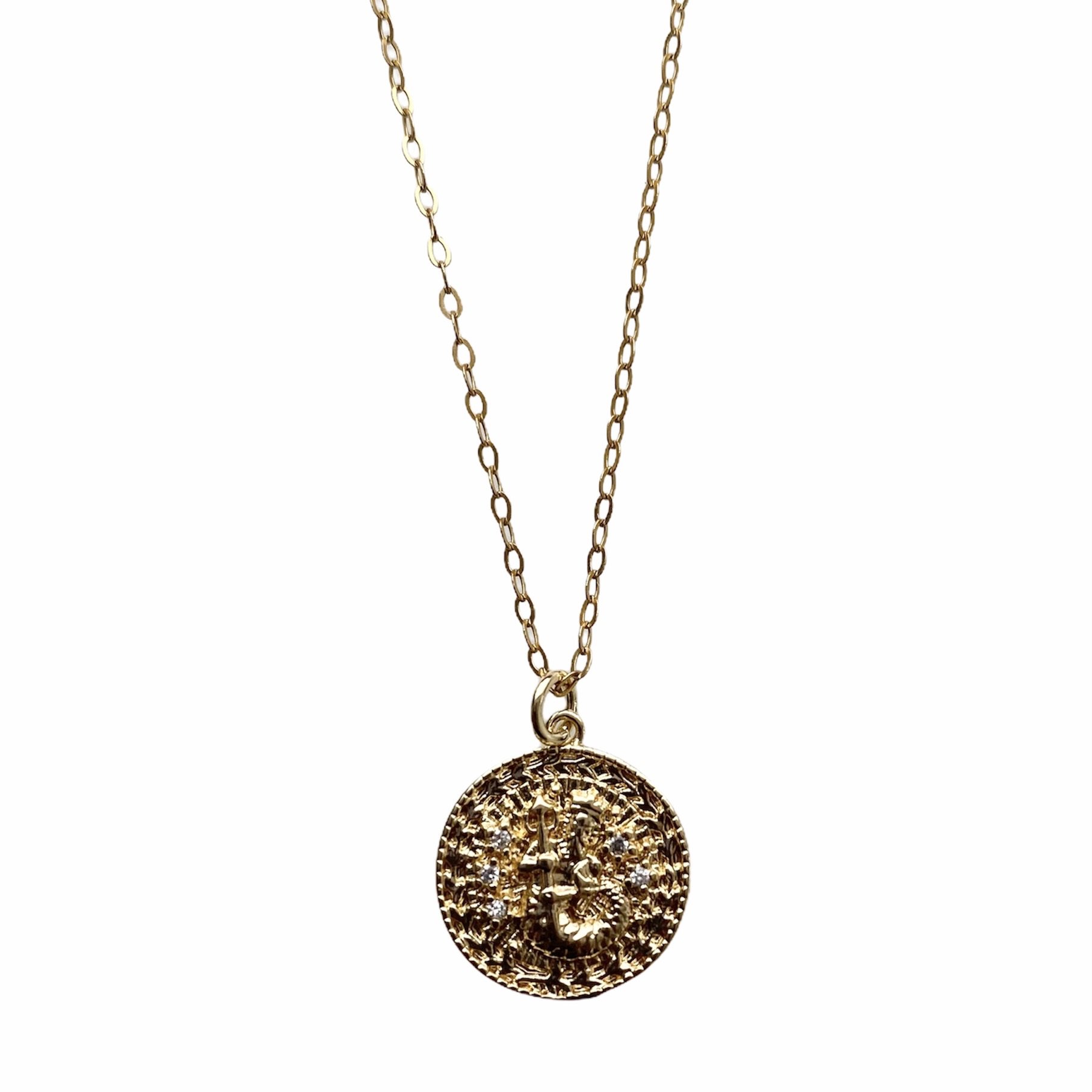 Celestial Vibes Zodiac Necklace featuring a 14K gold filled chain and zirconia encrusted pendant, elegantly displayed.