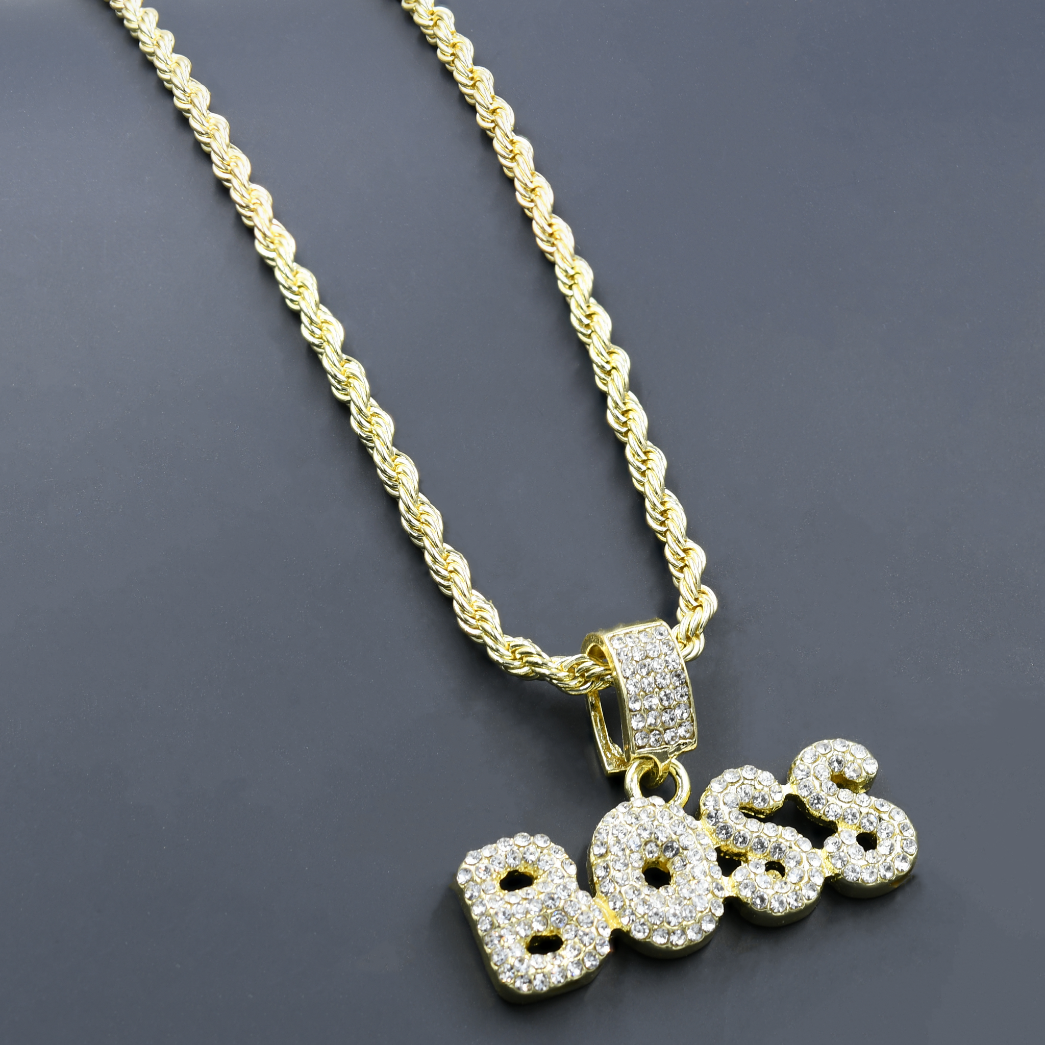 CHAIN AND CHARM - D90062 featuring a crystal-studded pendant on a 24'' rope chain, showcasing intricate design and luxurious appeal.