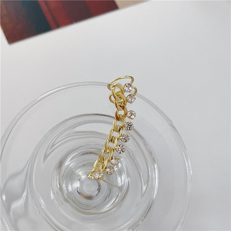 A stylish chain ear stud and clip featuring multi-rhinestones, made from durable alloy, measuring 5cm in length.