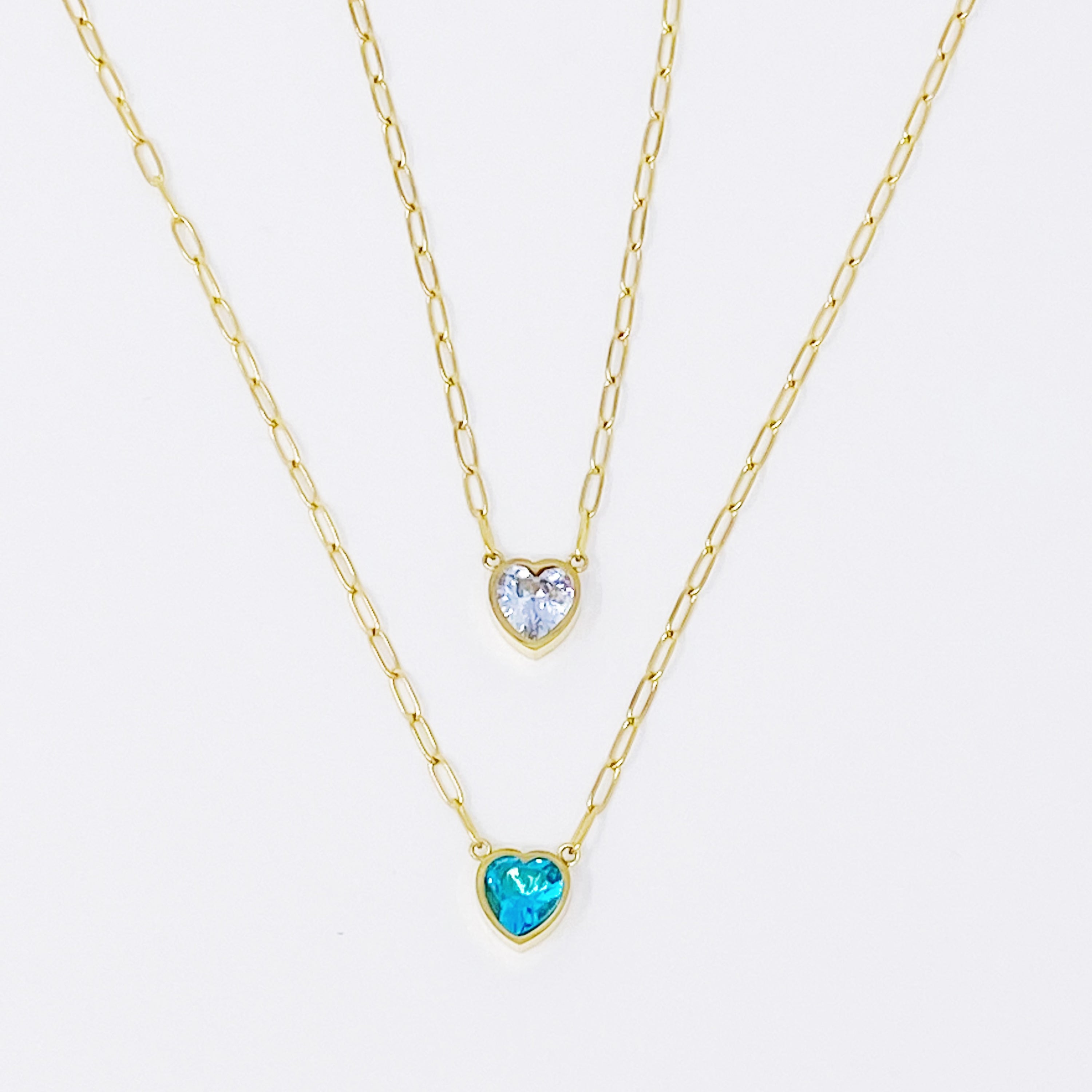 Chained To My Heart Necklace featuring a sparkly heart pendant and trendy link chain, showcasing its reversible design.