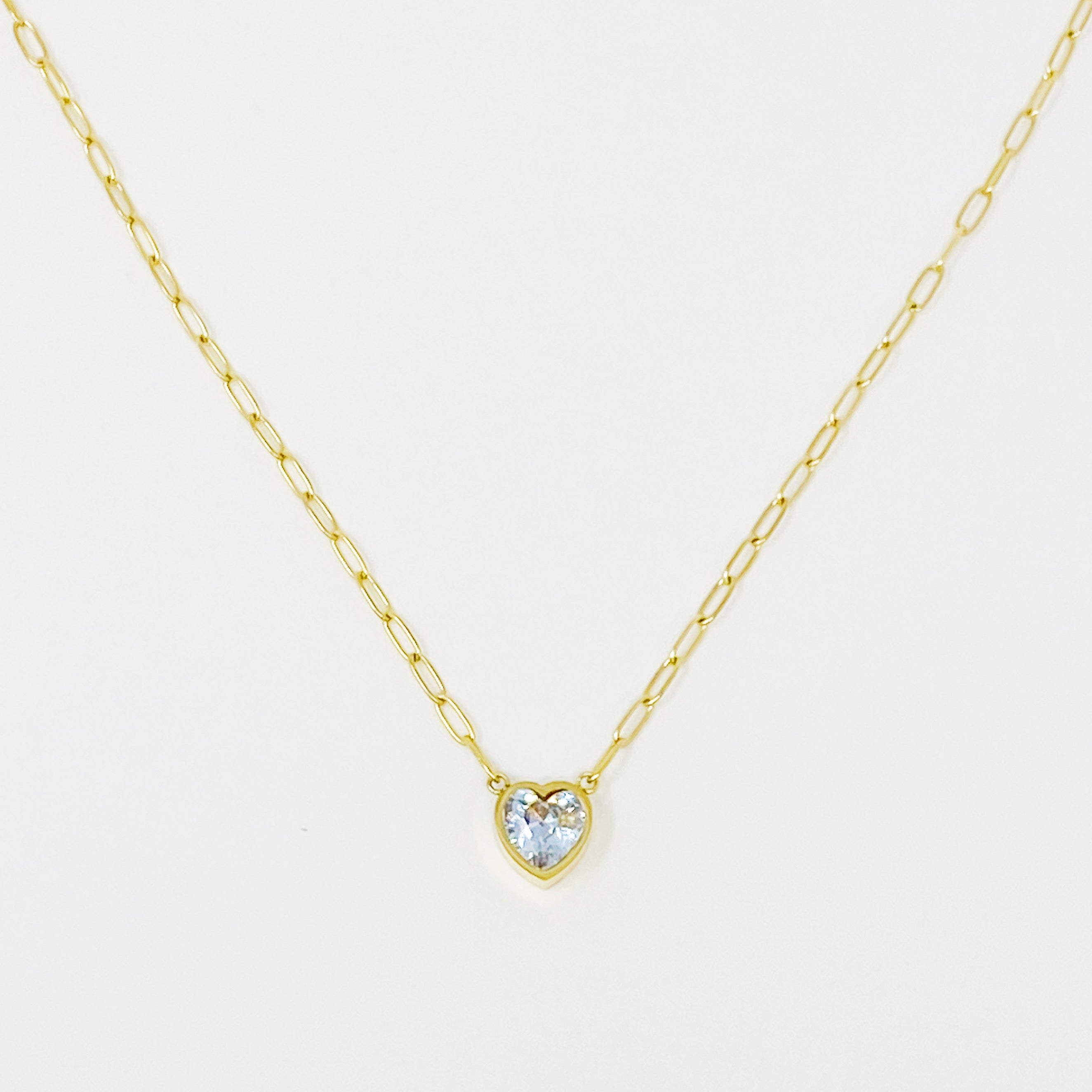 Chained To My Heart Necklace featuring a sparkly heart pendant and trendy link chain, showcasing its reversible design.