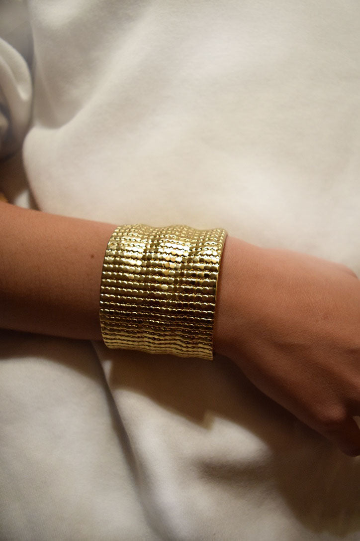 A stylish Chainmail Cuff Bracelet featuring a textured surface, available in gold, silver, and rose gold finishes.