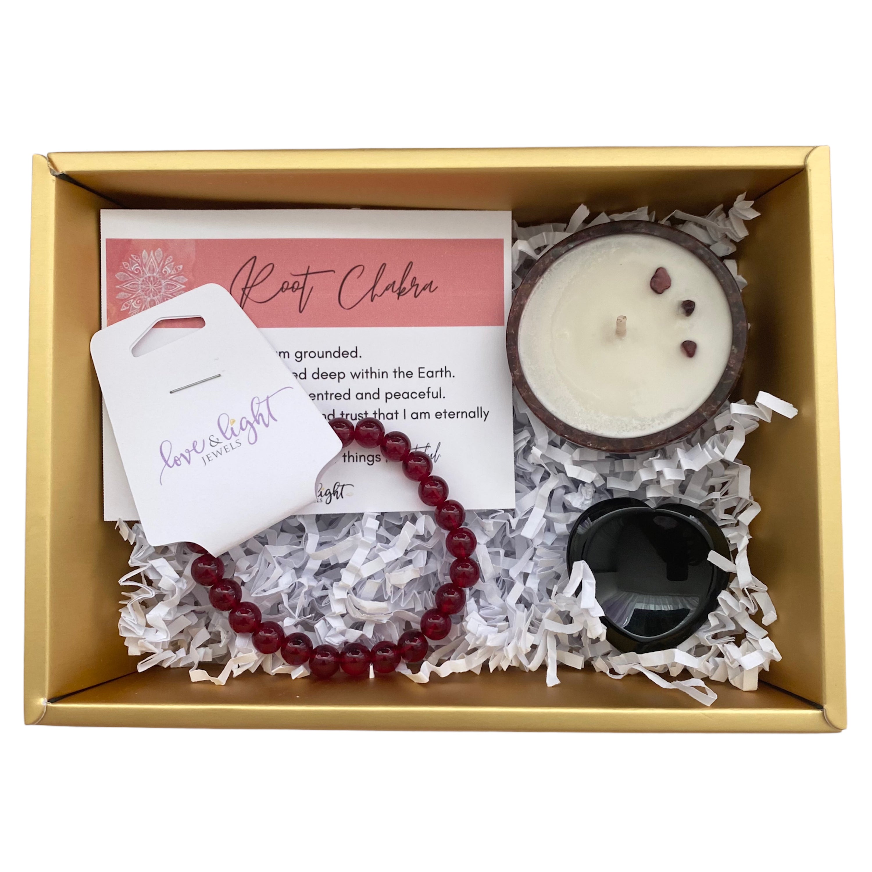 Chakra Healing Gift Set featuring affirmation card, beaded bracelet, heart-shaped worry stone, and crystal infused tea light in gemstone bowl.