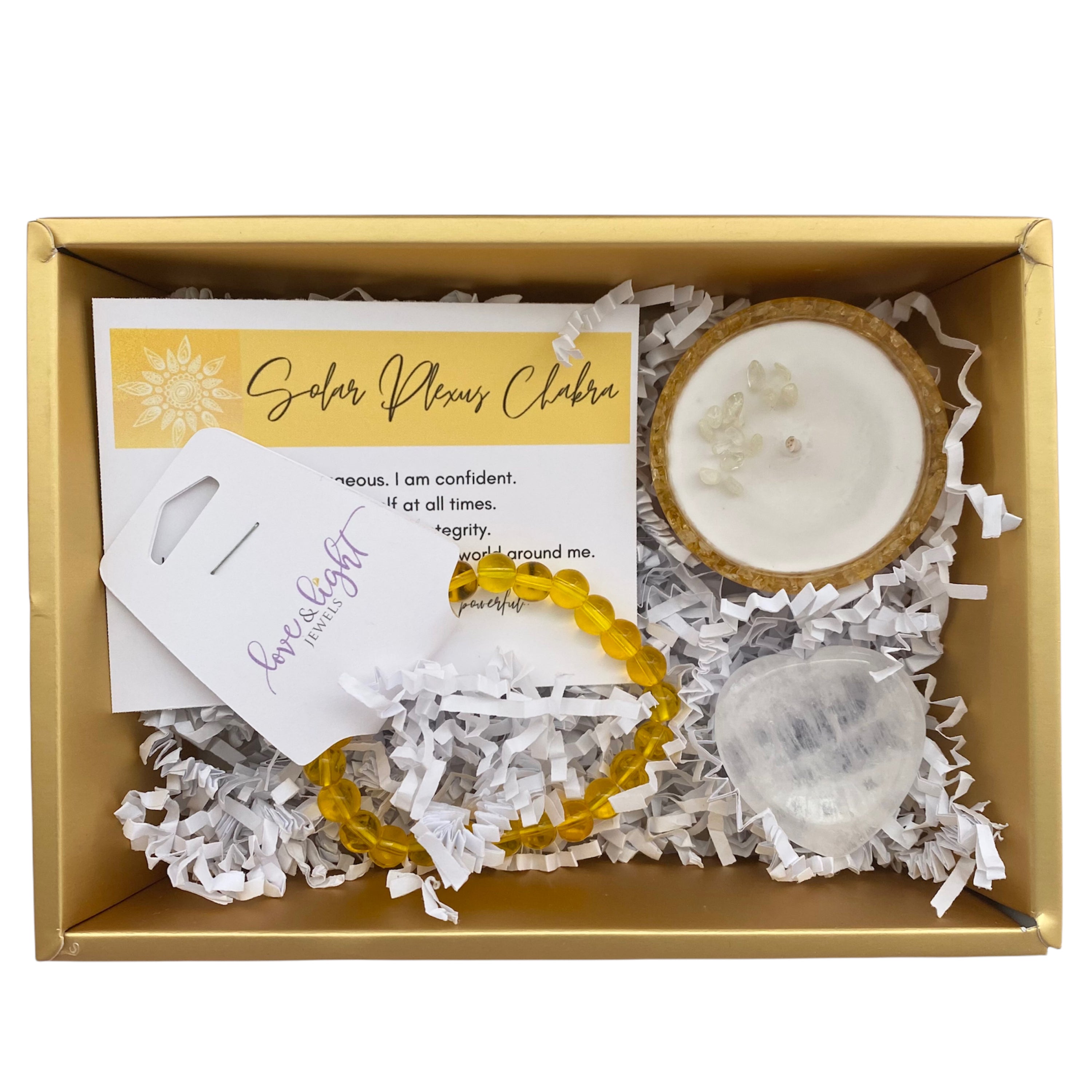 Chakra Healing Gift Set featuring affirmation card, beaded bracelet, heart-shaped worry stone, and crystal infused tea light in gemstone bowl.