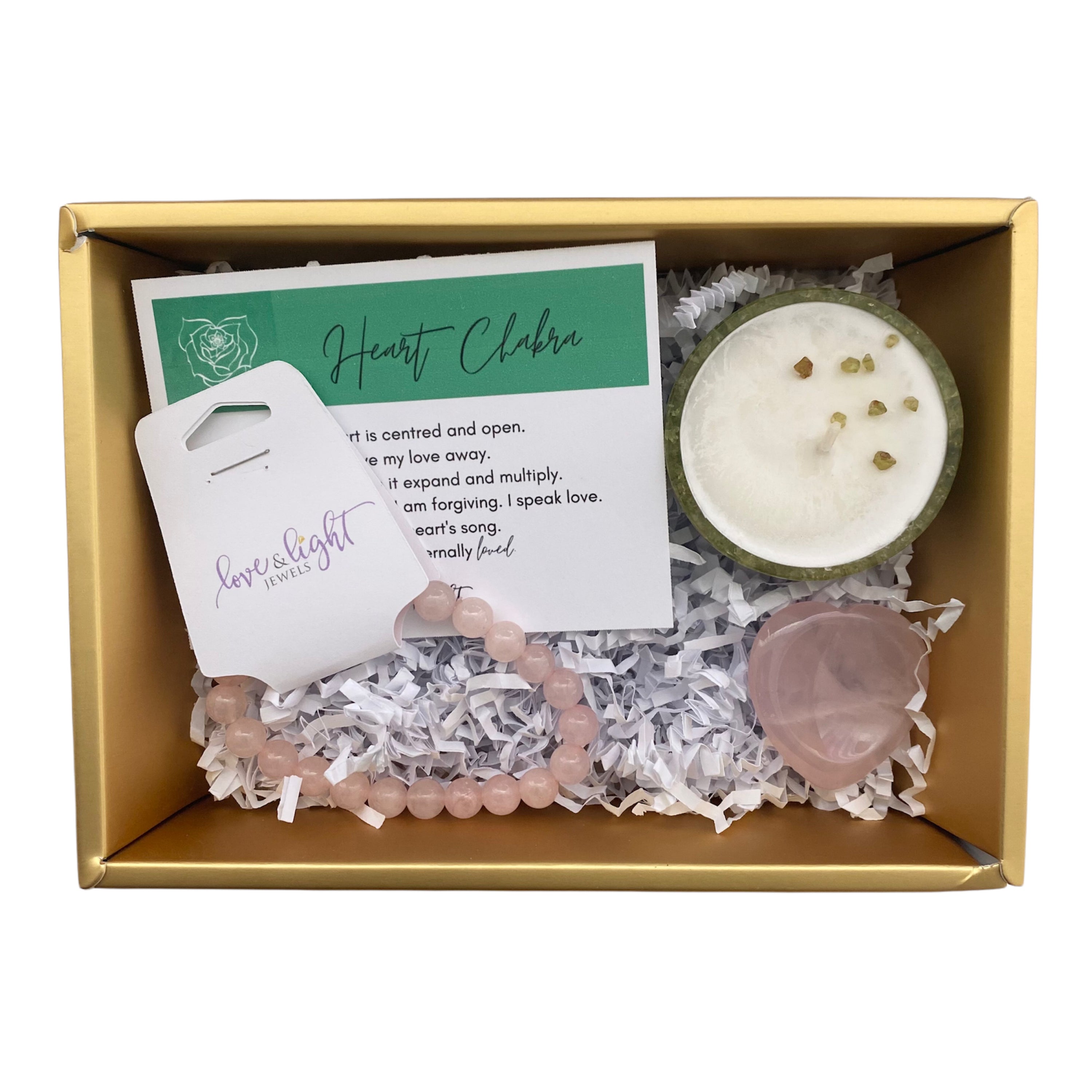 Chakra Healing Gift Set featuring affirmation card, beaded bracelet, heart-shaped worry stone, and crystal infused tea light in gemstone bowl.