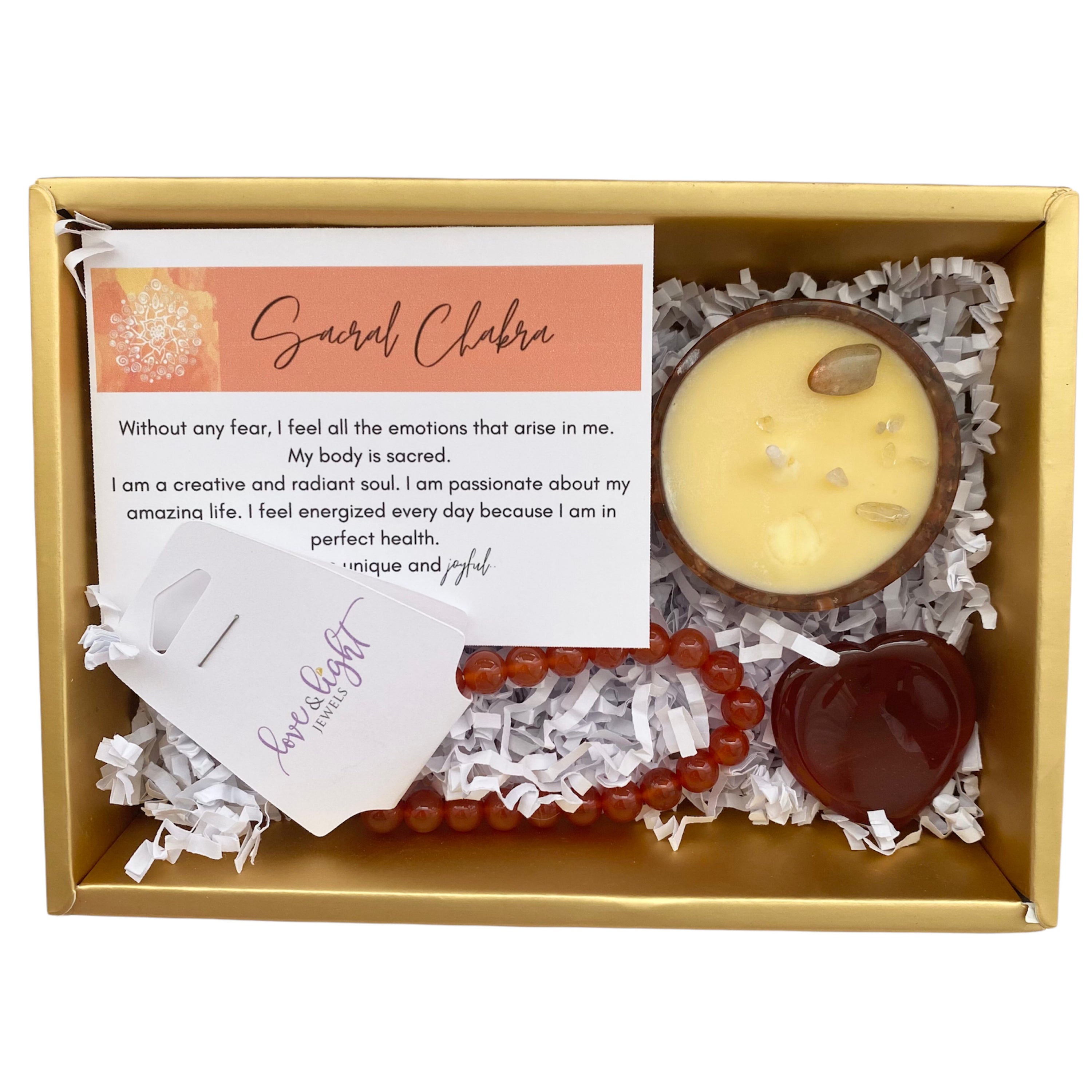 Chakra Healing Gift Set featuring affirmation card, beaded bracelet, heart-shaped worry stone, and crystal infused tea light in gemstone bowl.