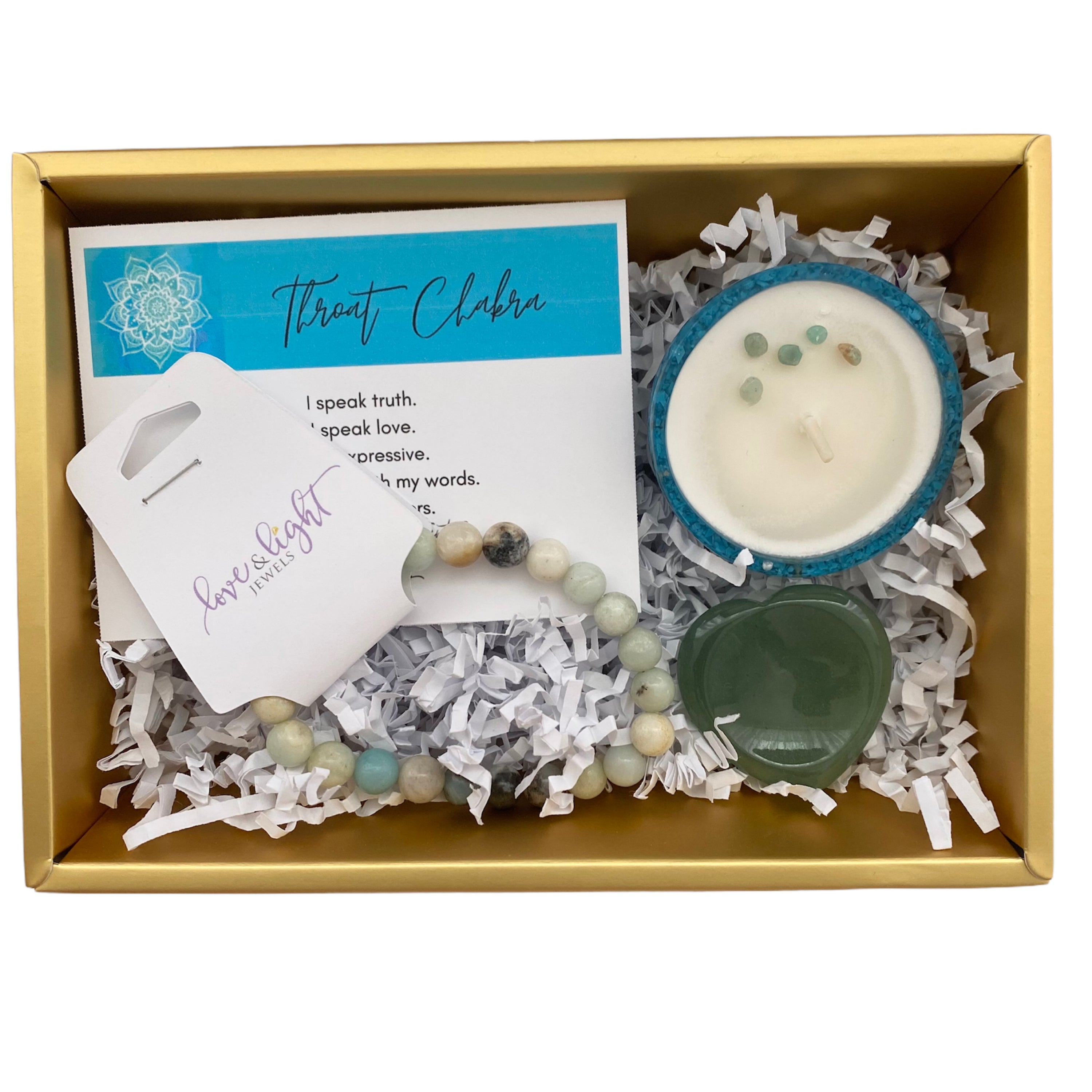 Chakra Healing Gift Set featuring affirmation card, beaded bracelet, heart-shaped worry stone, and crystal infused tea light in gemstone bowl.