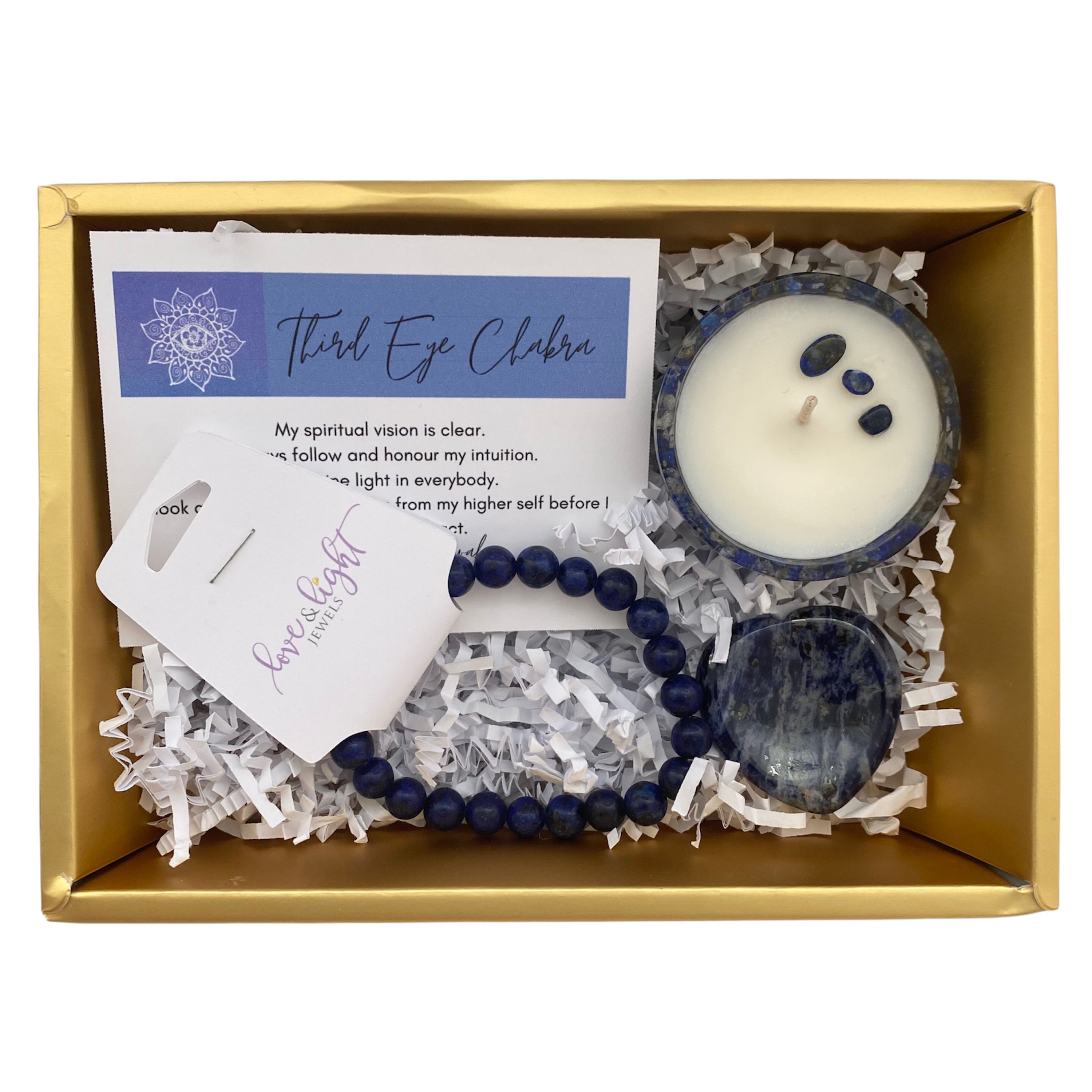 Chakra Healing Gift Set featuring affirmation card, beaded bracelet, heart-shaped worry stone, and crystal infused tea light in gemstone bowl.