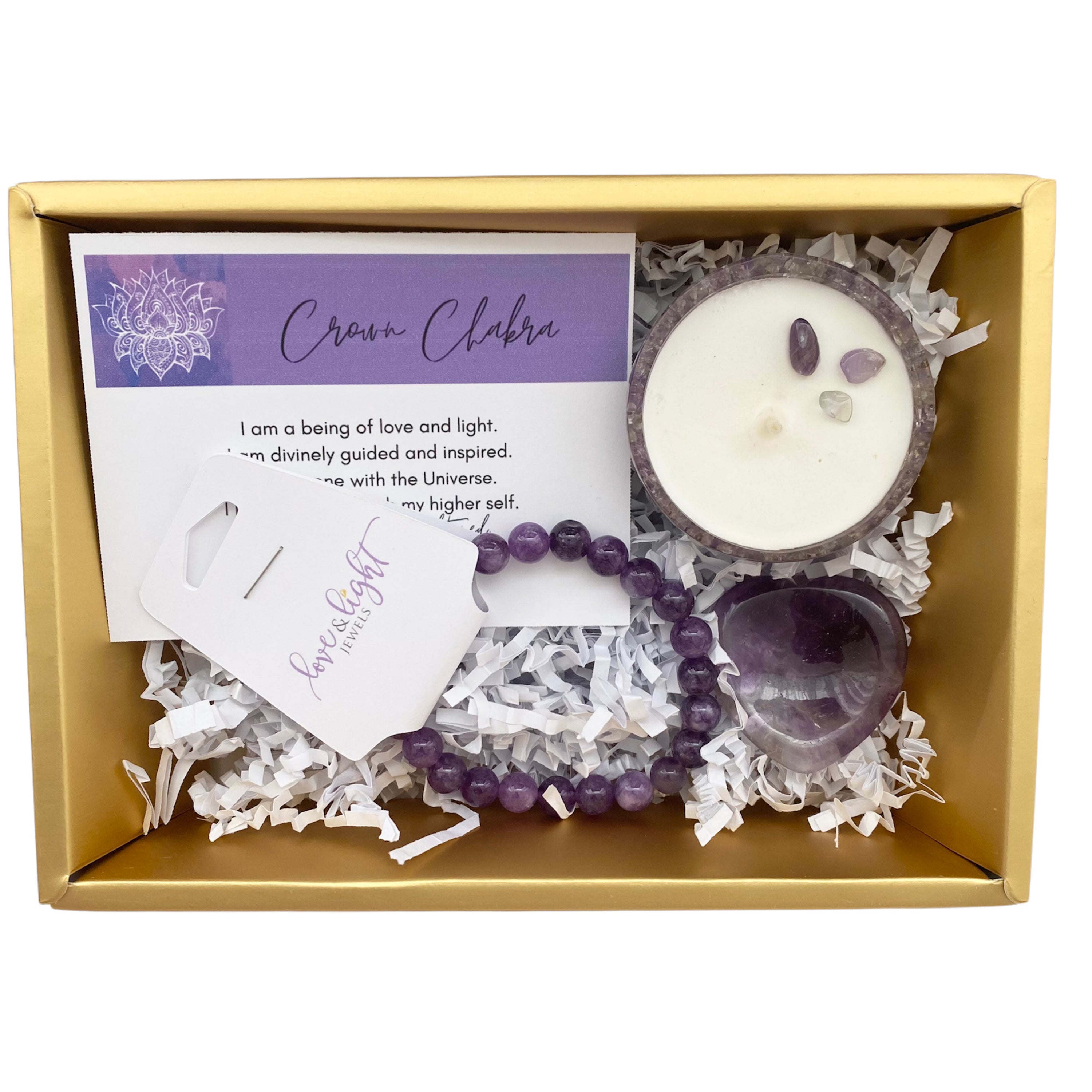 Chakra Healing Gift Set featuring affirmation card, beaded bracelet, heart-shaped worry stone, and crystal infused tea light in gemstone bowl.