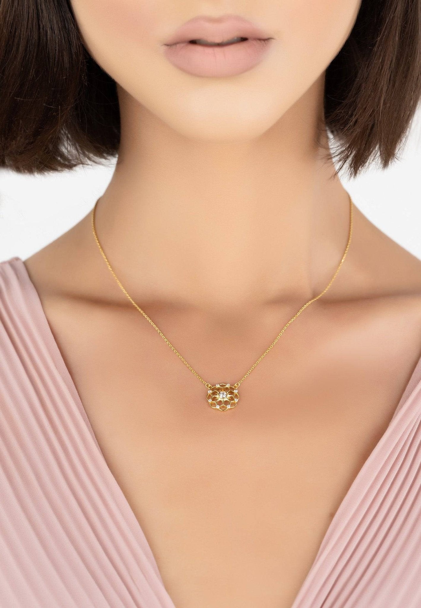 Chakra Pendant Necklace in gold with white zirconia, showcasing a delicate design perfect for everyday wear.