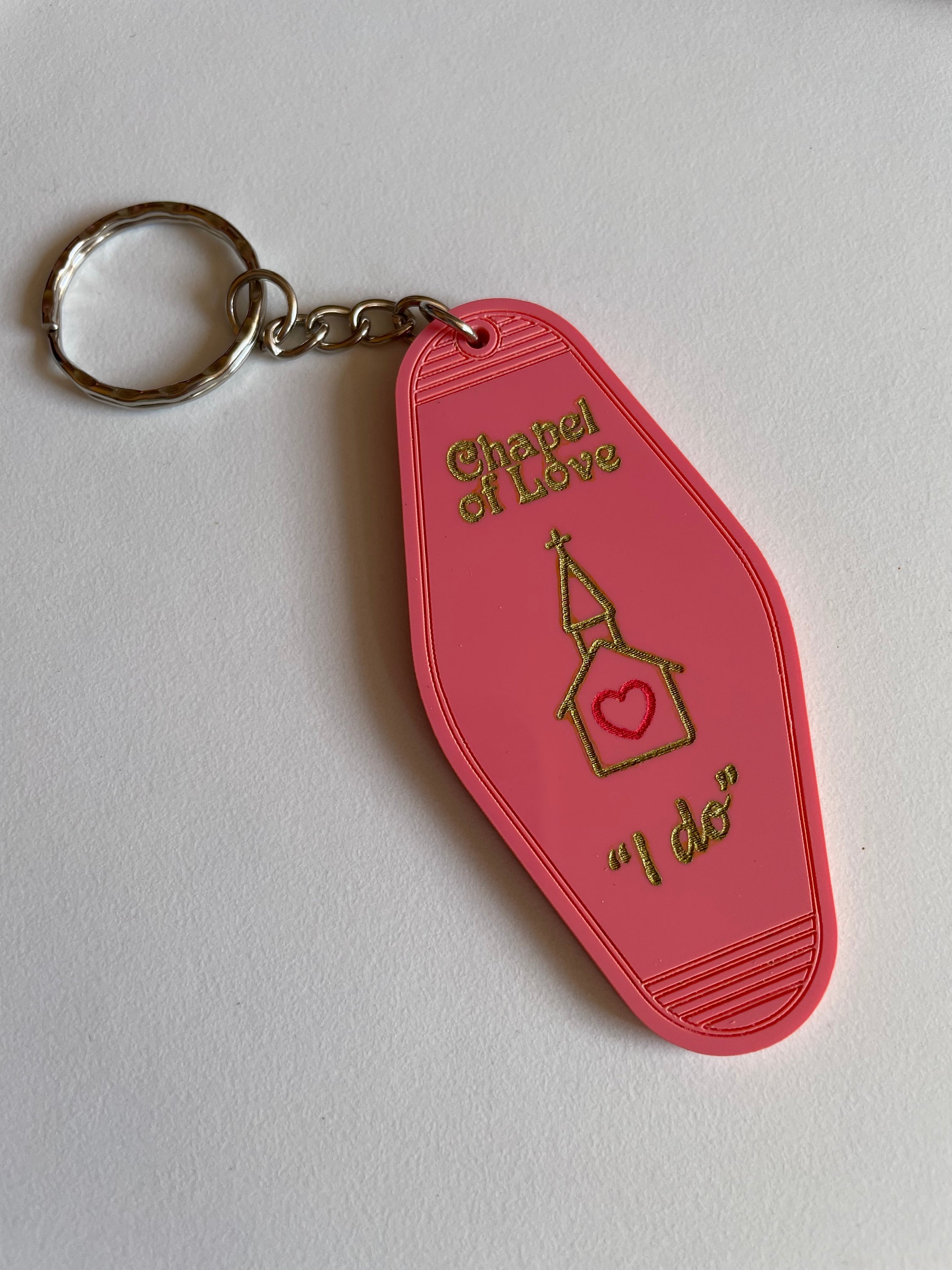 Chapel of Love Keyring featuring laser cut acrylic design, inspired by 1960s and 70s fashion trends, with dimensions of 8cm height and 4cm width.