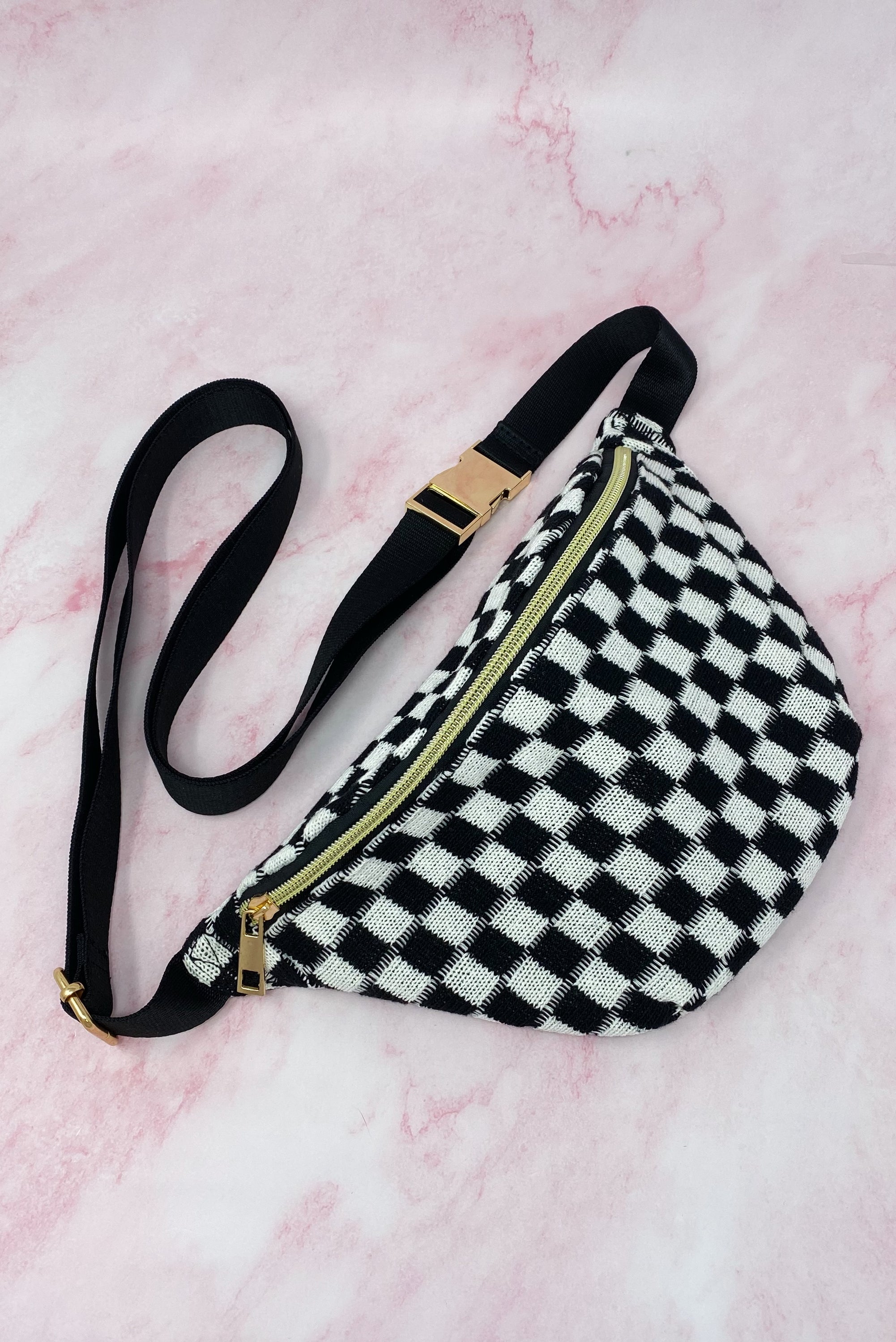 Check Yourself Belt Sling Bag featuring checkered knit material and gold-tone hardware, adjustable strap for comfort.