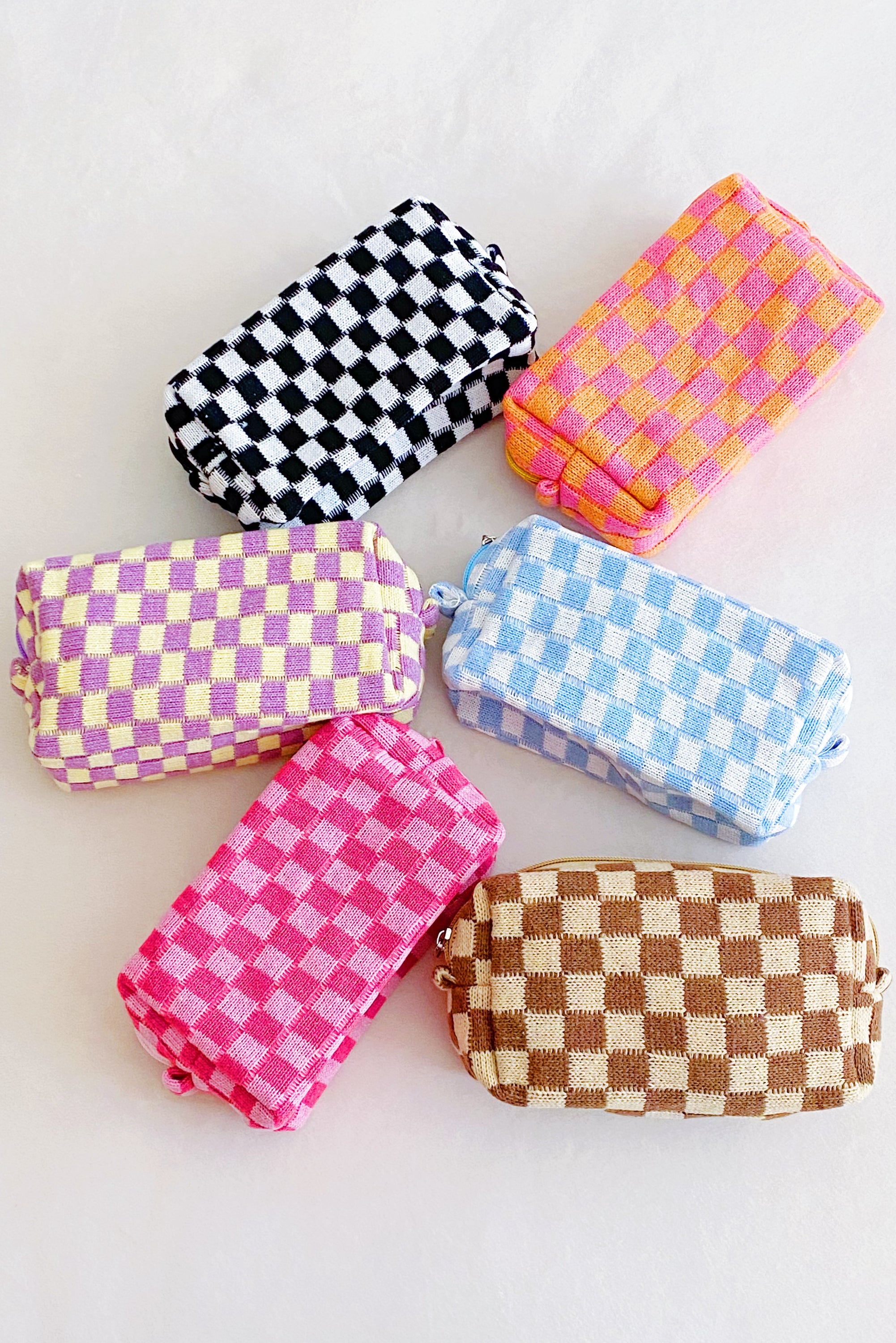 Check Yourself Cosmetic Bag with a stylish checkered pattern and light vinyl lining, perfect for organizing beauty essentials.