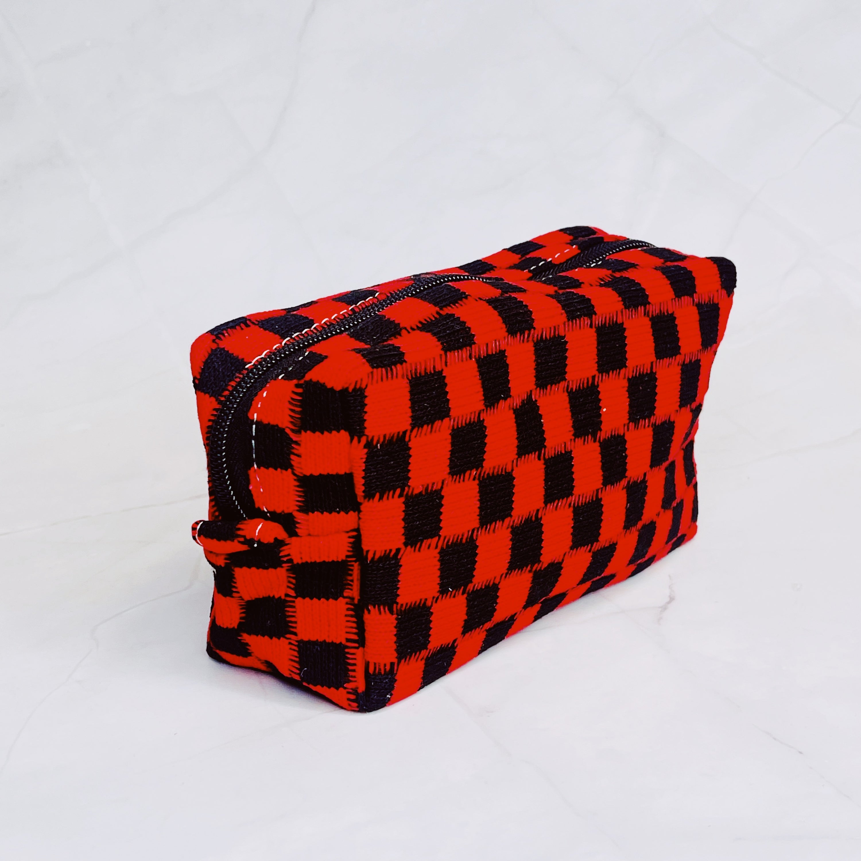 Check Yourself Cosmetic Bag with a stylish checkered pattern and light vinyl lining, perfect for organizing beauty essentials.