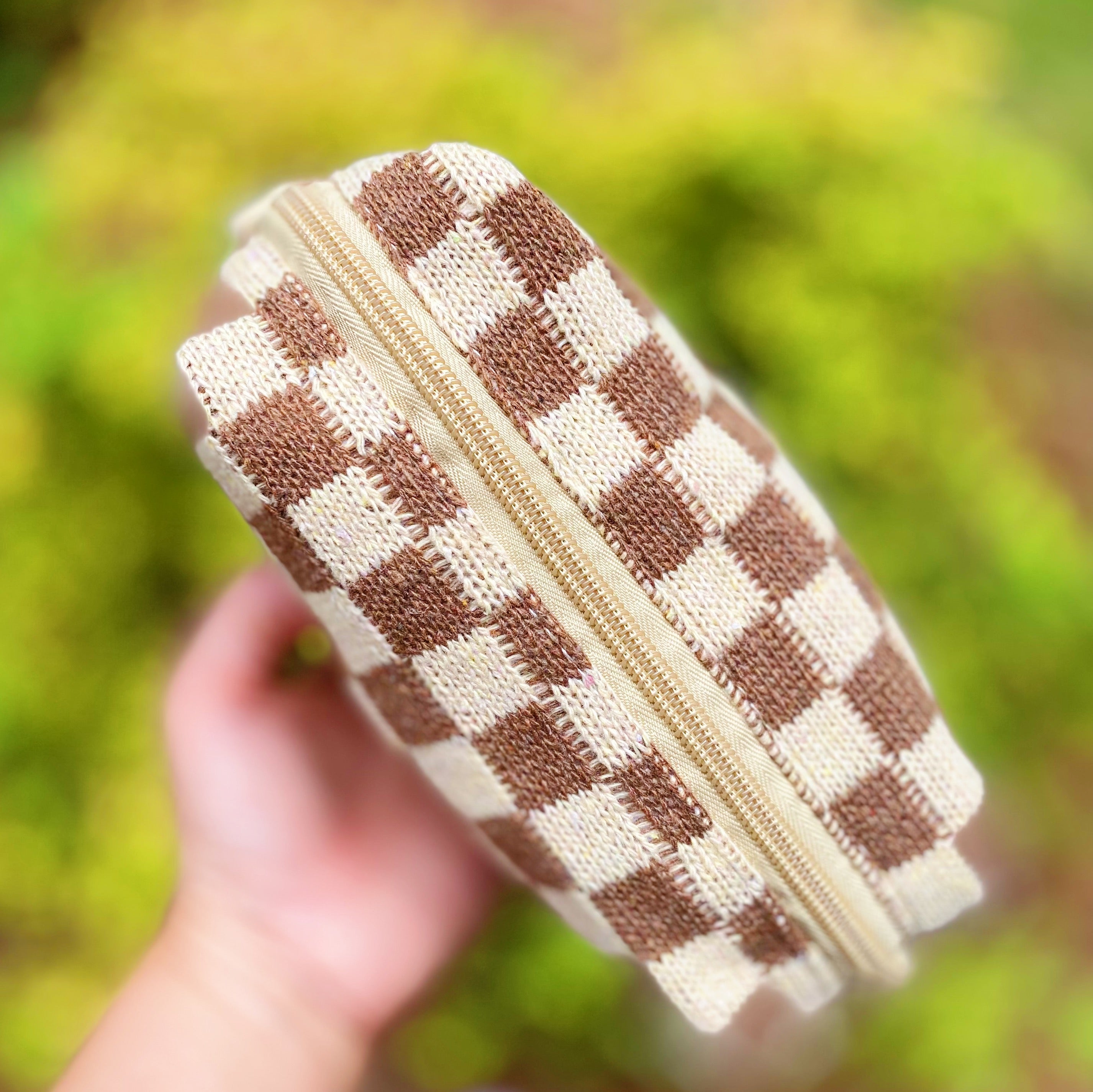 Check Yourself Cosmetic Bag with a stylish checkered pattern and light vinyl lining, perfect for organizing beauty essentials.