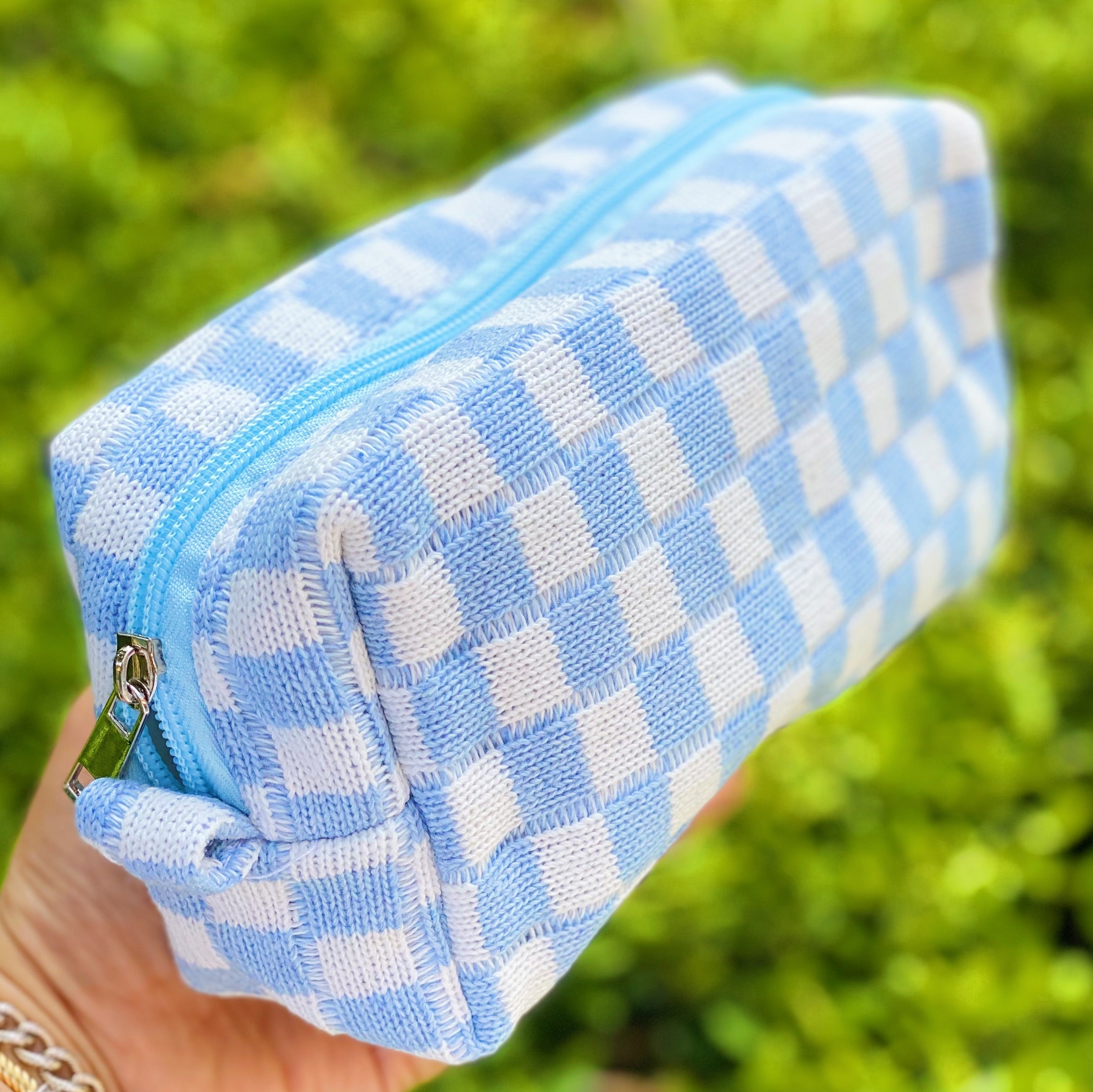 Check Yourself Cosmetic Bag with a stylish checkered pattern and light vinyl lining, perfect for organizing beauty essentials.