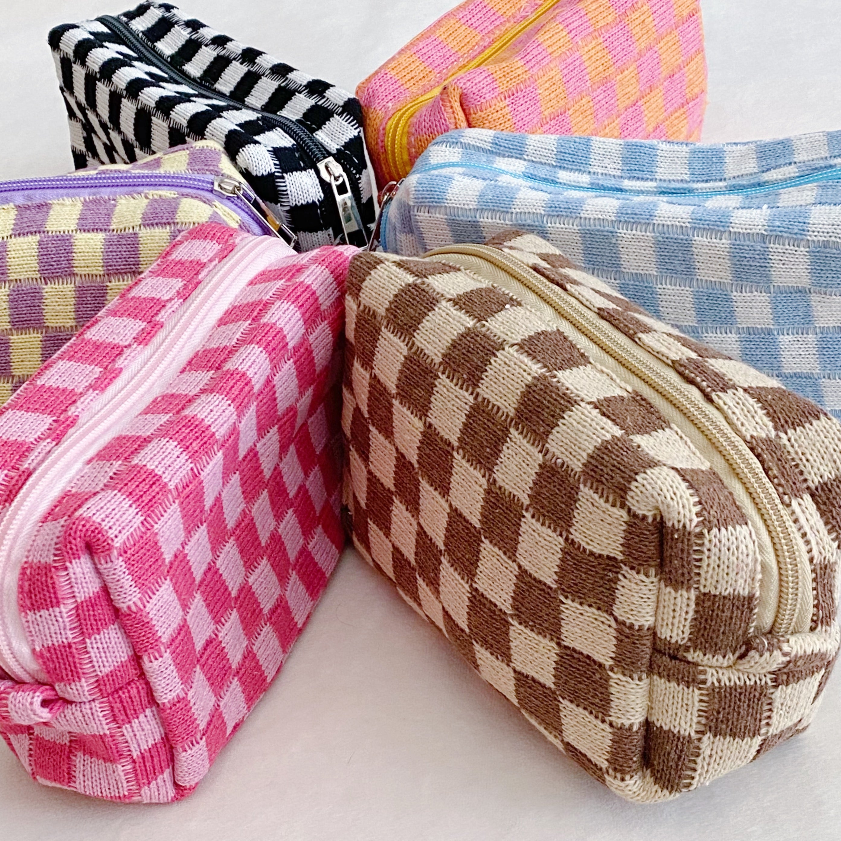 Check Yourself Cosmetic Bag with a stylish checkered pattern and light vinyl lining, perfect for organizing beauty essentials.