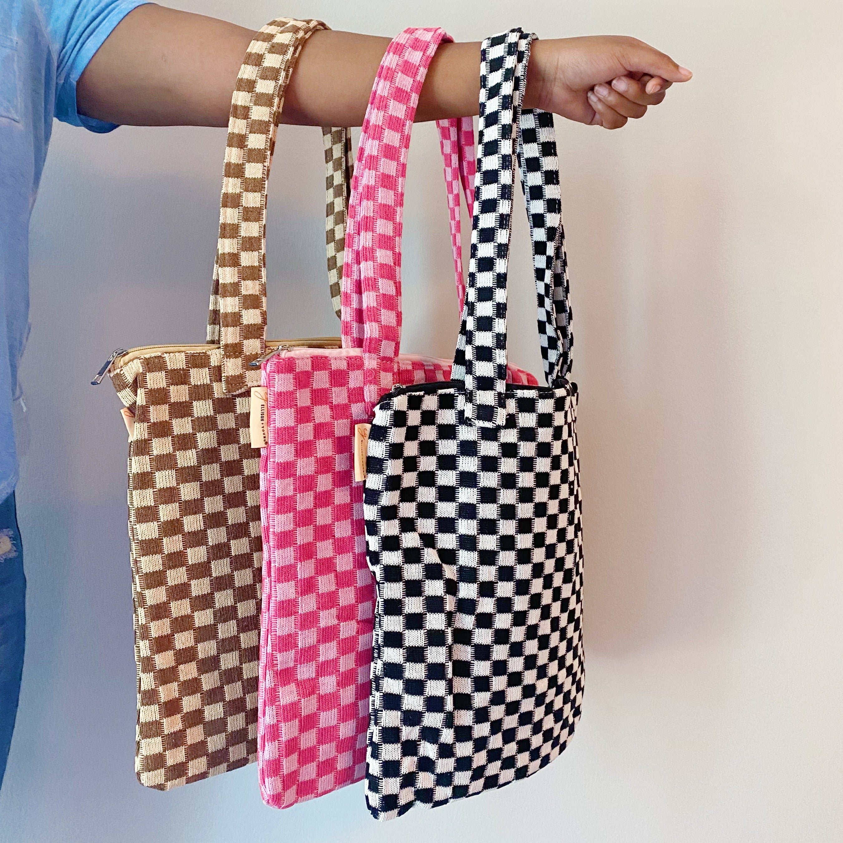 Check Yourself Zipped Tote Bag featuring a classic checkered pattern, secure zipper closure, and durable fabric straps.