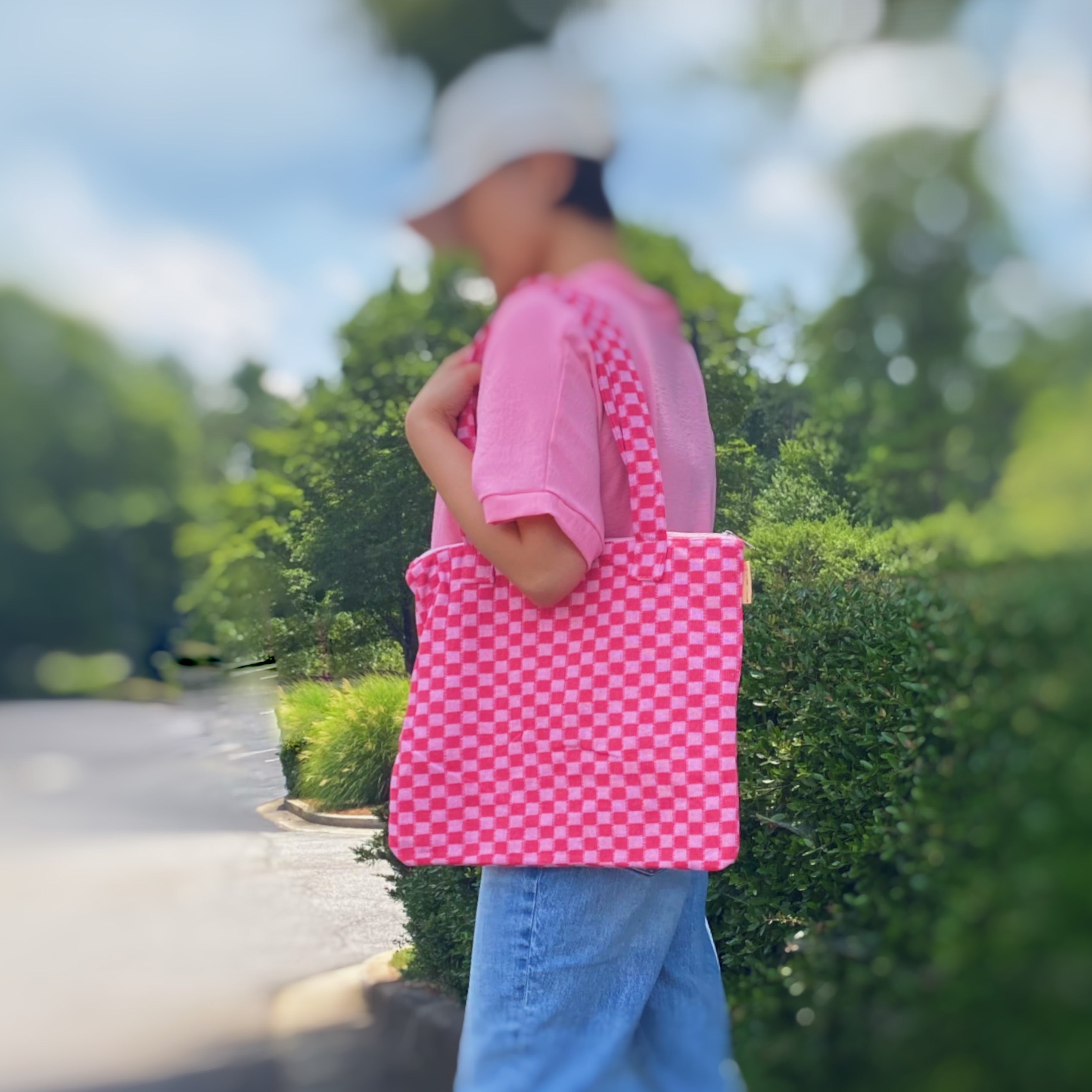 Check Yourself Zipped Tote Bag featuring a classic checkered pattern, secure zipper closure, and durable fabric straps.