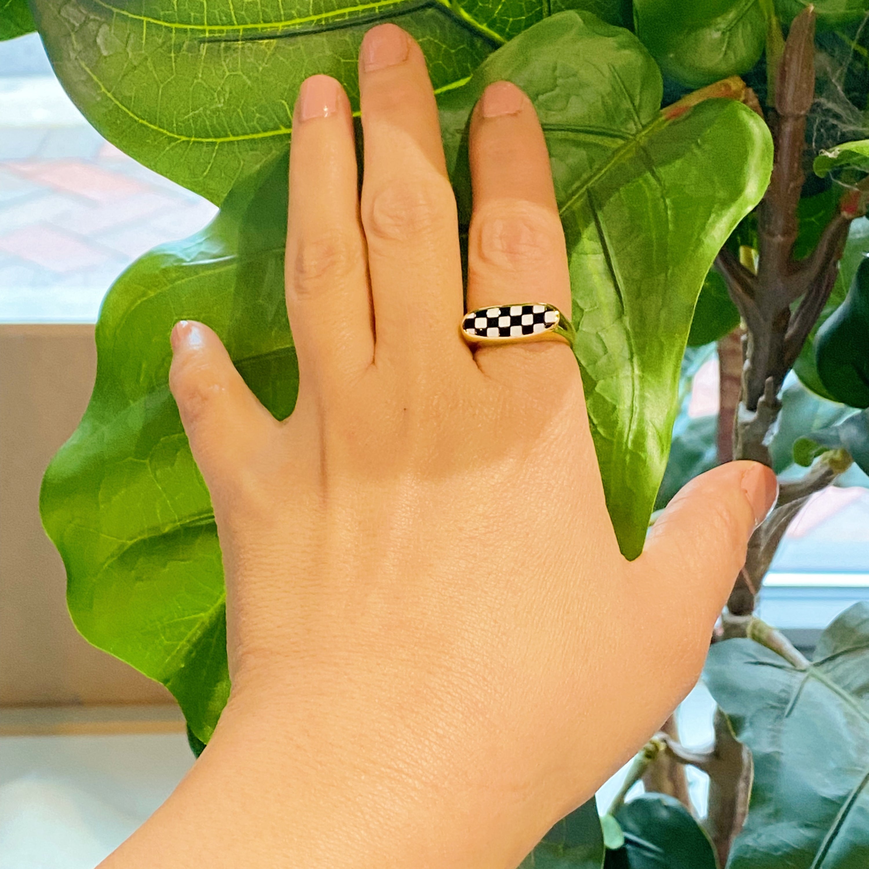 Checkered Oblong Ring featuring a unique curved shape and polished finish, crafted from 18K gold-plated stainless steel.