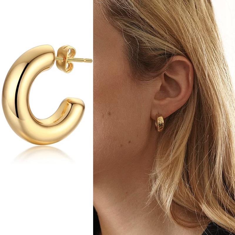 Chloe Mini Hoop earrings in rhodium or 18k gold plating, showcasing their chunky design and elegant finish.