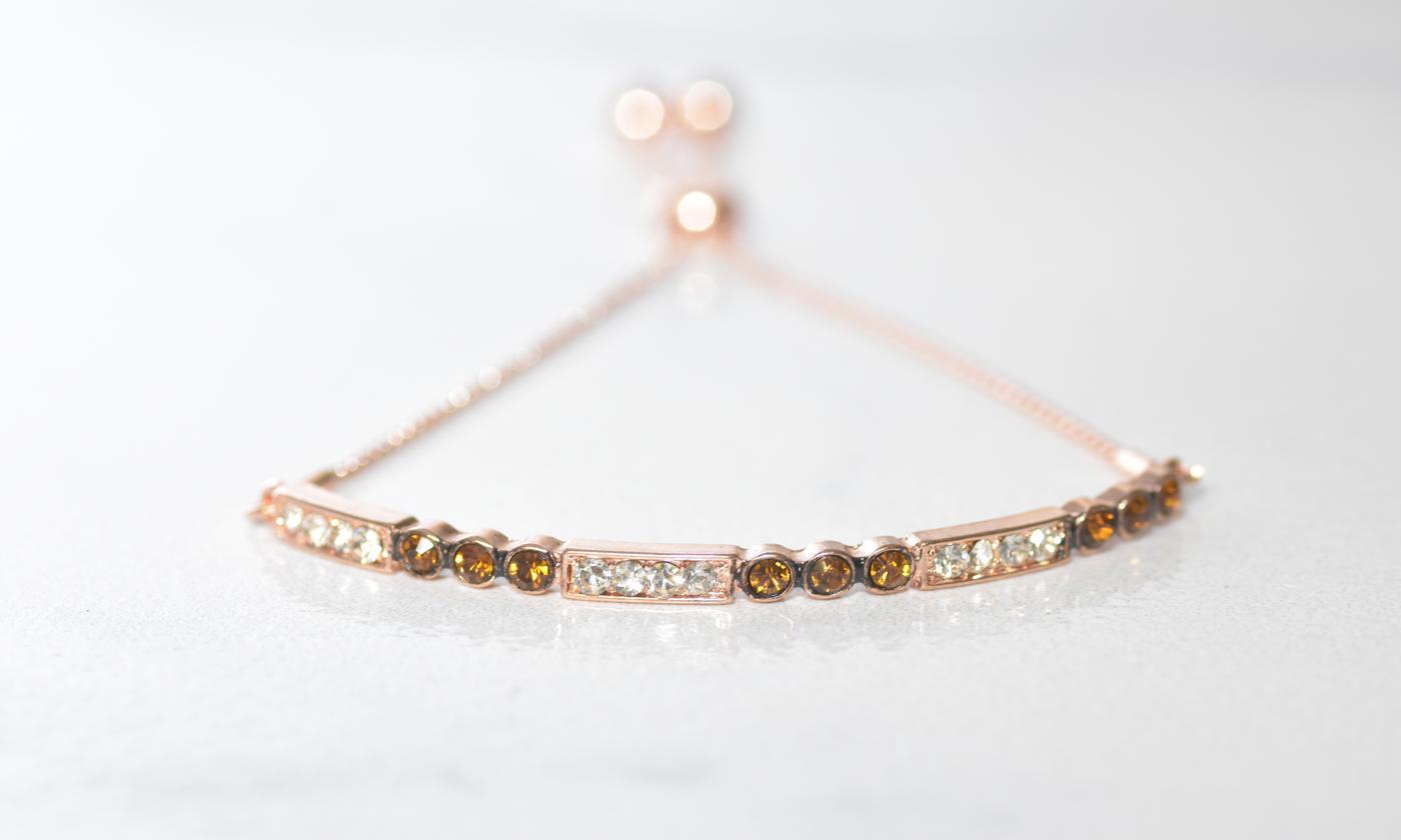 Chocolate toned bar bracelet featuring 14K rose gold plating, elegant link chain, and pull-clasp design.