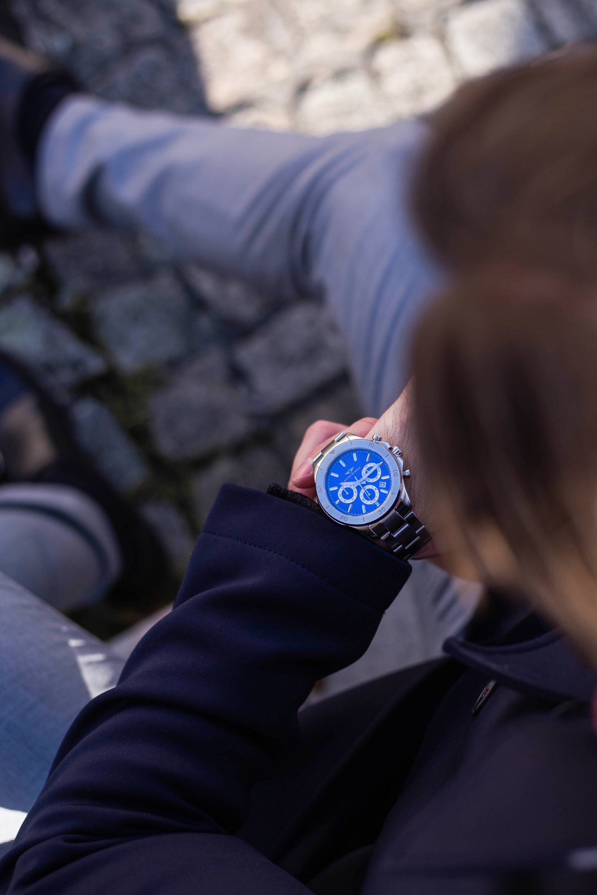 Chronograph One watch in silver with lapis blue accents, featuring a stainless steel case, sapphire crystal glass, and a sunray dial.