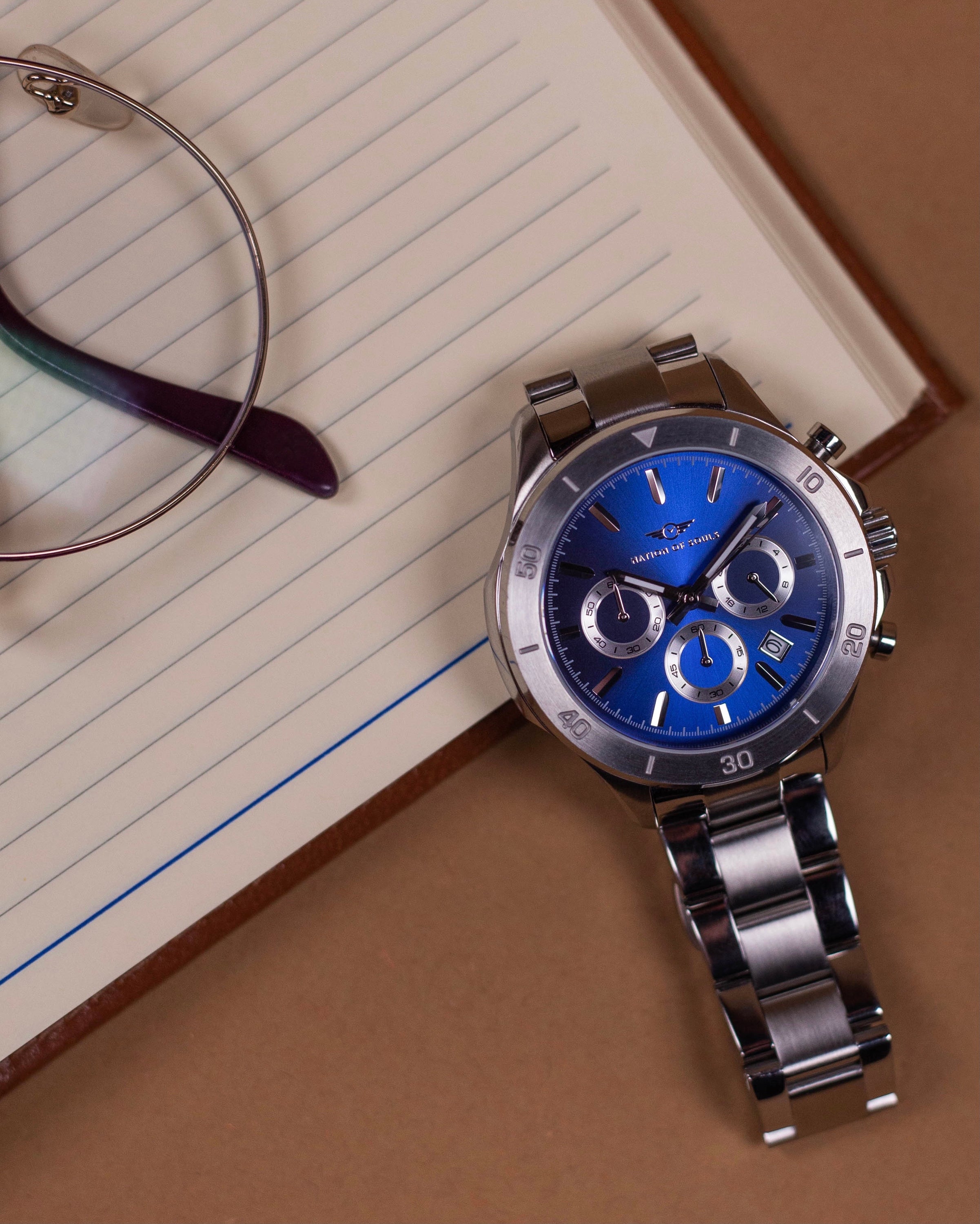 Chronograph One watch in silver with lapis blue accents, featuring a stainless steel case, sapphire crystal glass, and a sunray dial.