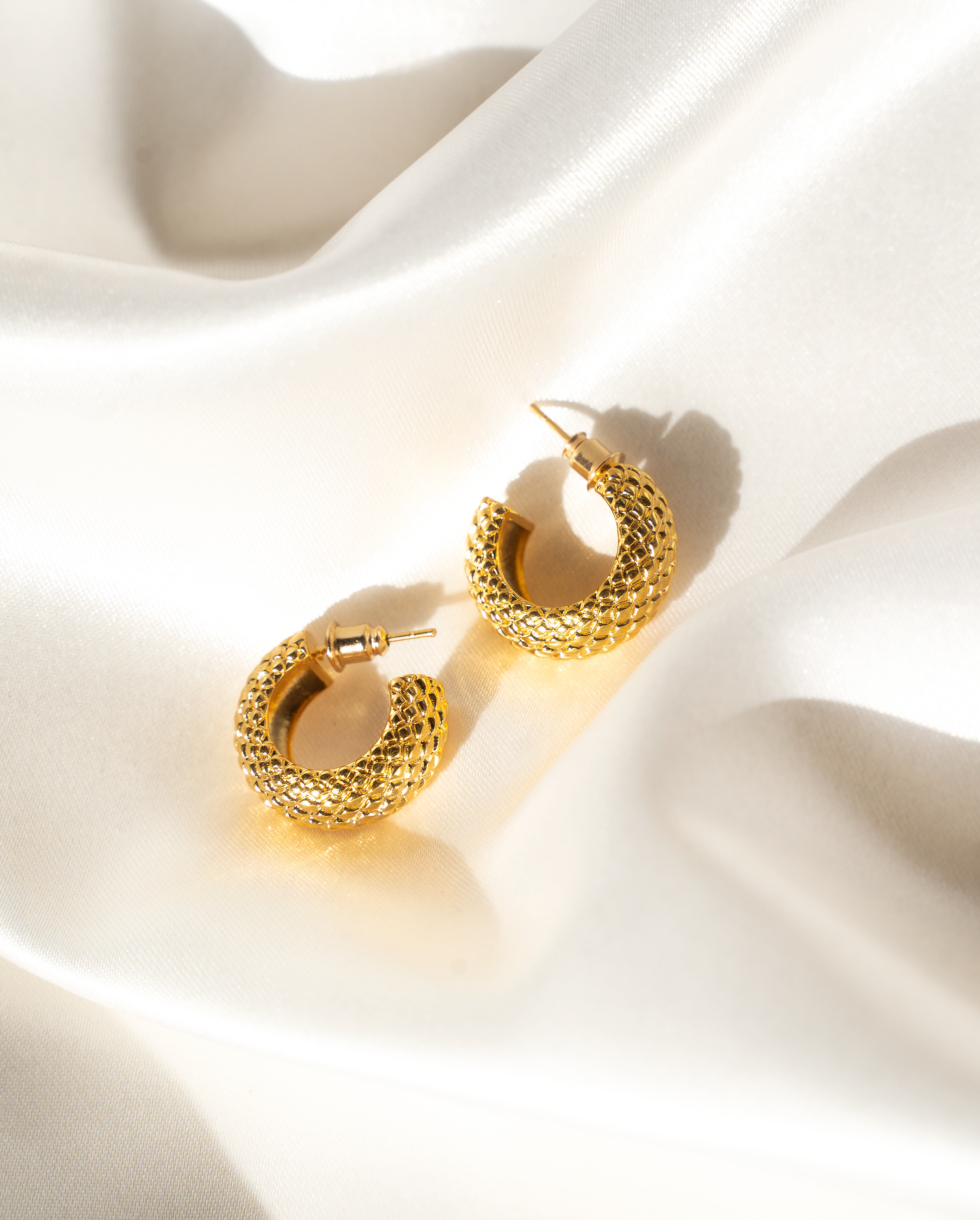 CIARA Hoop Earrings featuring a textured woven basket pattern in luxurious 14K gold plating.