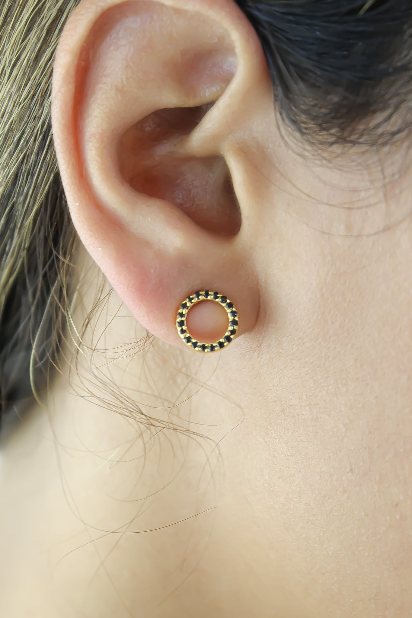 Elegant 18K gold-plated circle earrings adorned with sparkling zirconia stones, designed for pierced ears and hypoallergenic for sensitive skin.