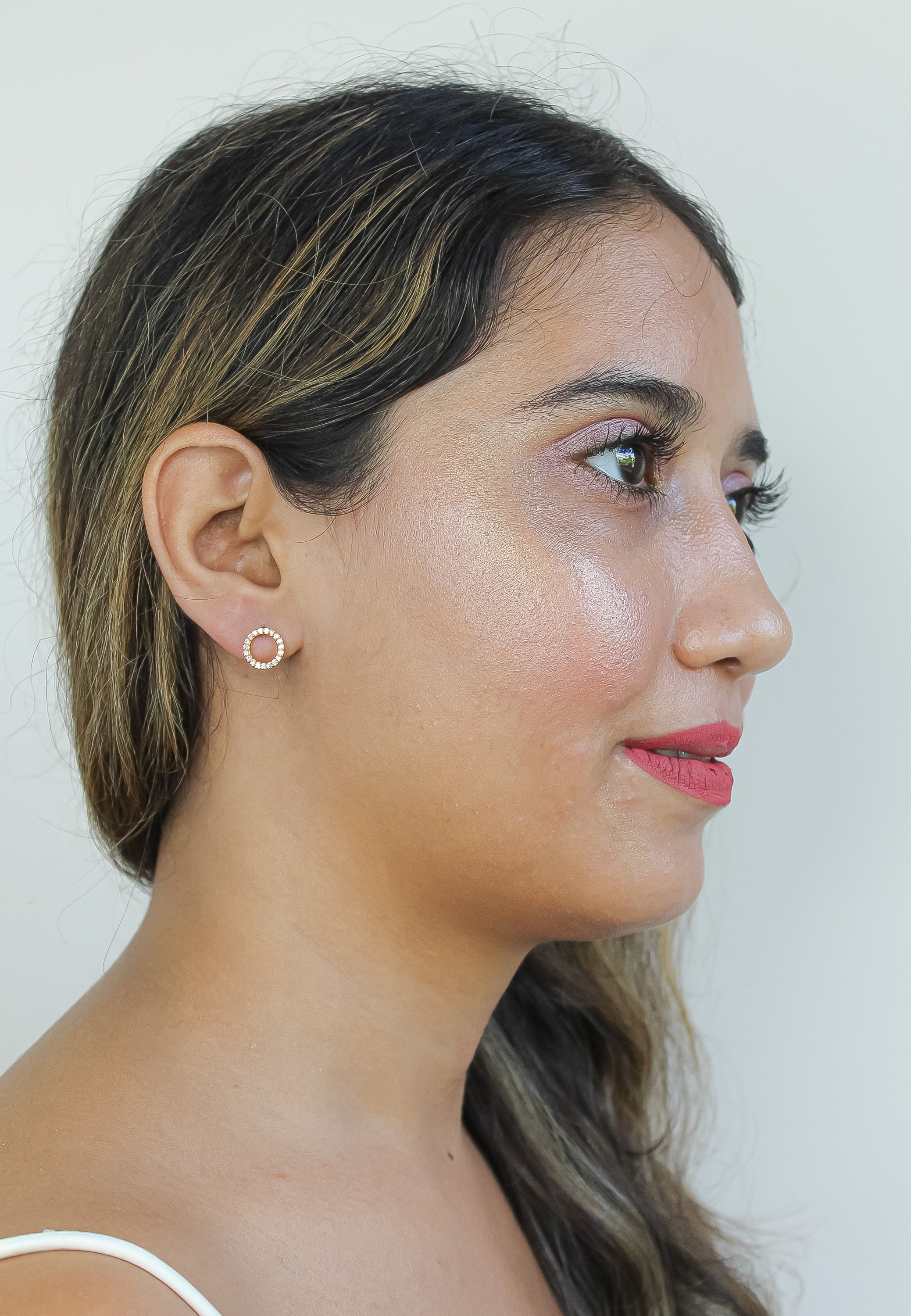 Elegant 18K gold-plated circle earrings adorned with sparkling zirconia stones, designed for pierced ears and hypoallergenic for sensitive skin.