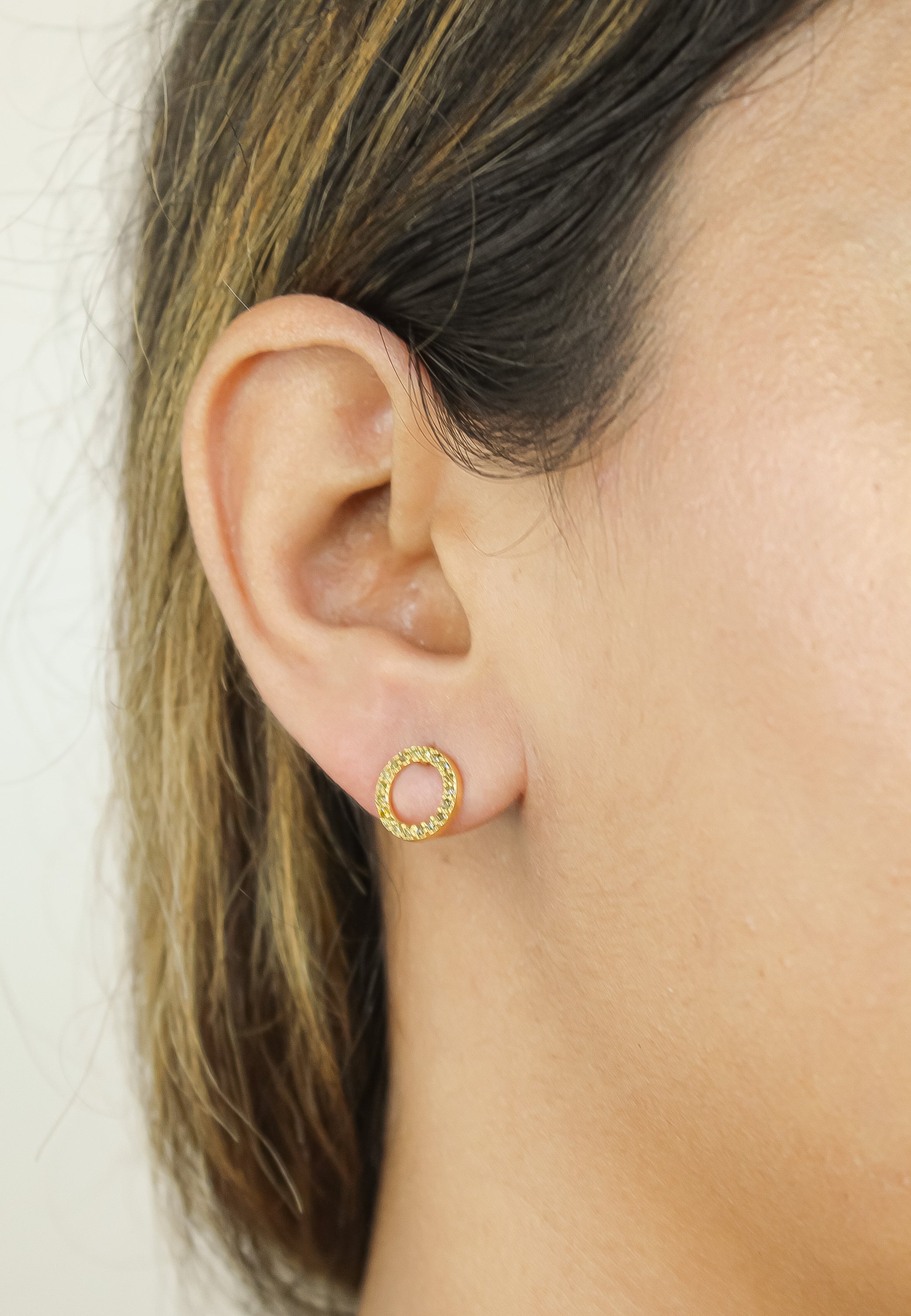 Elegant 18K gold-plated circle earrings adorned with sparkling zirconia stones, designed for pierced ears and hypoallergenic for sensitive skin.