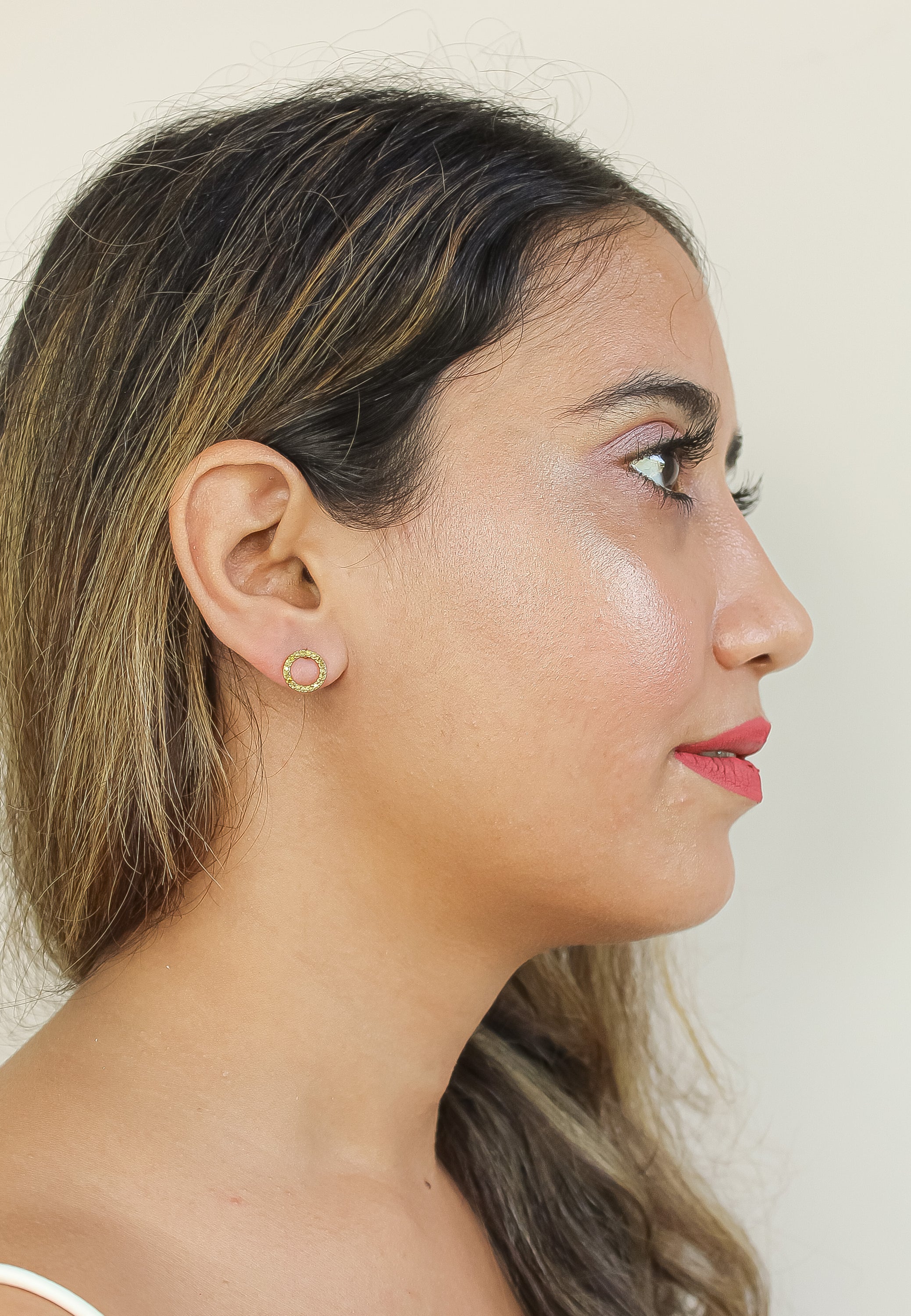 Elegant 18K gold-plated circle earrings adorned with sparkling zirconia stones, designed for pierced ears and hypoallergenic for sensitive skin.