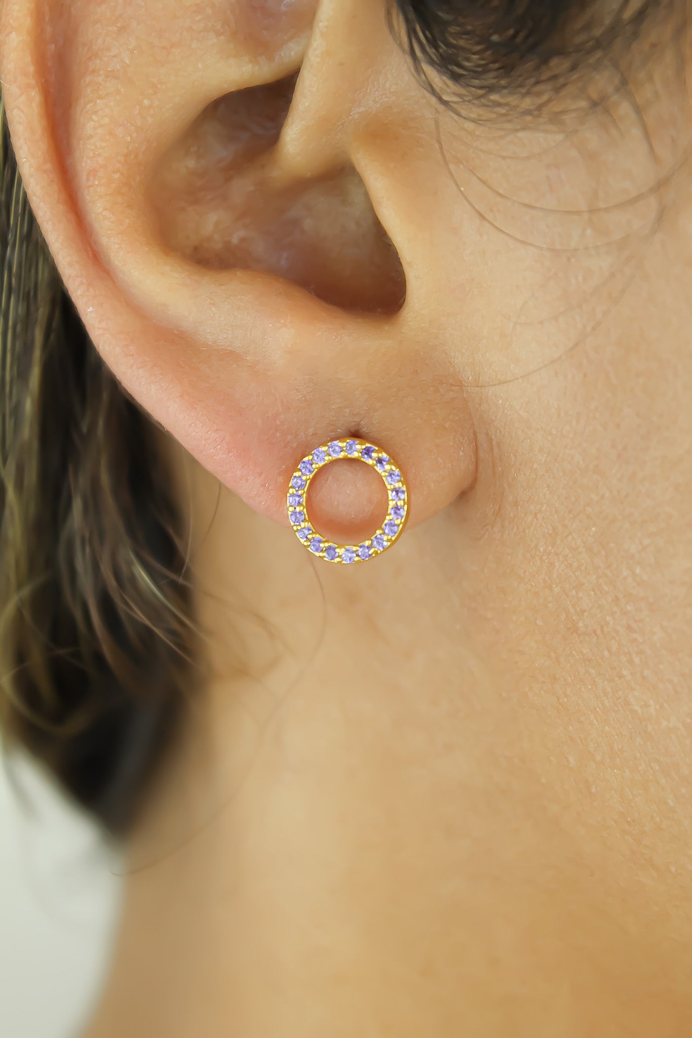 Elegant 18K gold-plated circle earrings adorned with sparkling zirconia stones, designed for pierced ears and hypoallergenic for sensitive skin.