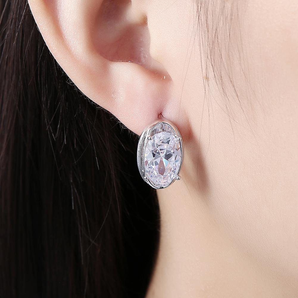 Elegant Circular Mid Elements Earrings crafted from 18K white gold, featuring certified crystals, designed for comfort and hypoallergenic wear.