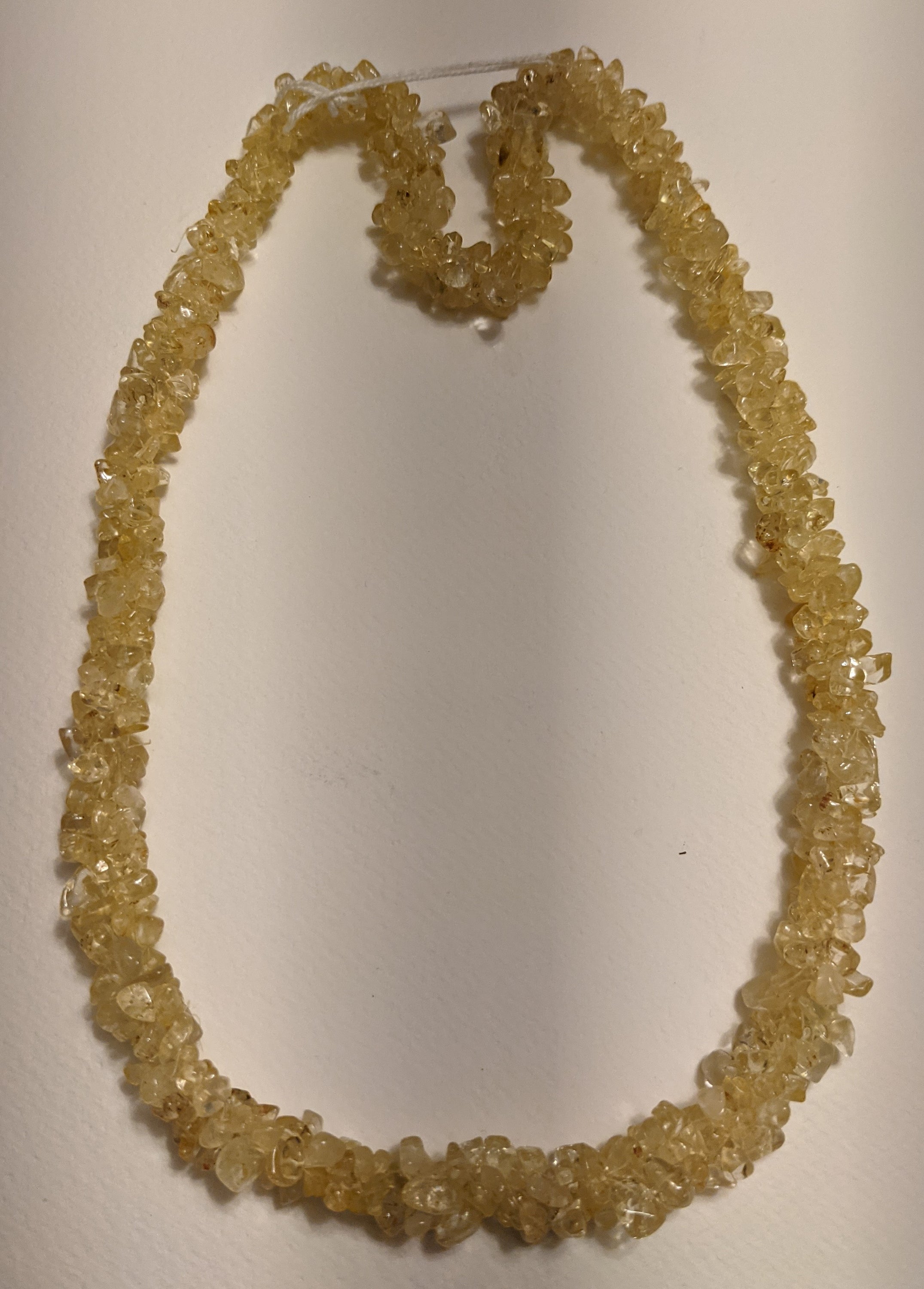 A beautiful handmade Citrine Chips Necklace featuring natural gemstone chips in vibrant yellow hues, measuring 24-25 inches in length.