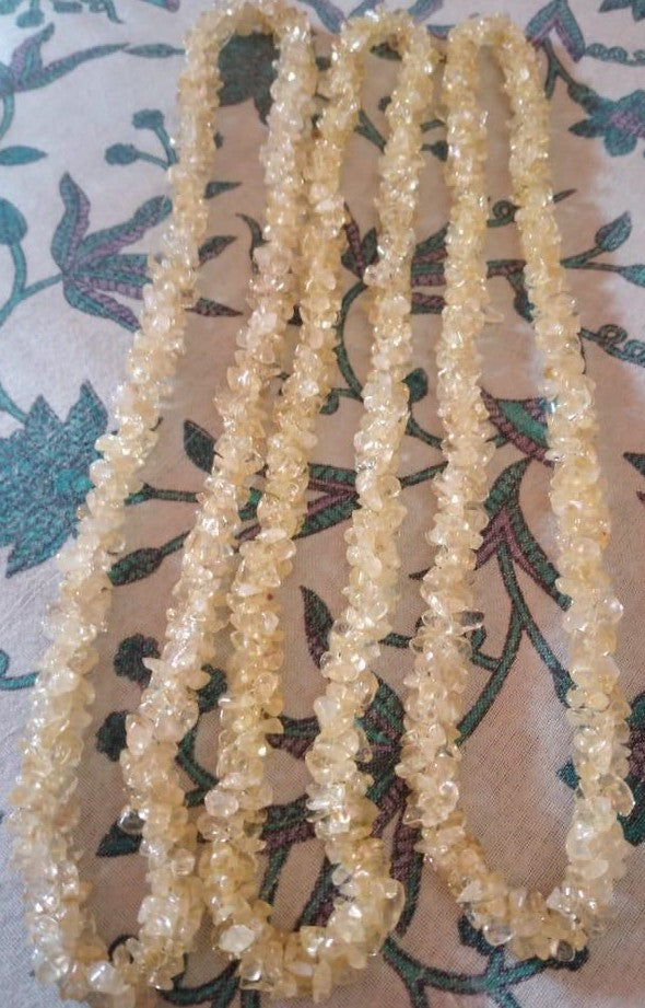 A beautiful handmade Citrine Chips Necklace featuring natural gemstone chips in vibrant yellow hues, measuring 24-25 inches in length.