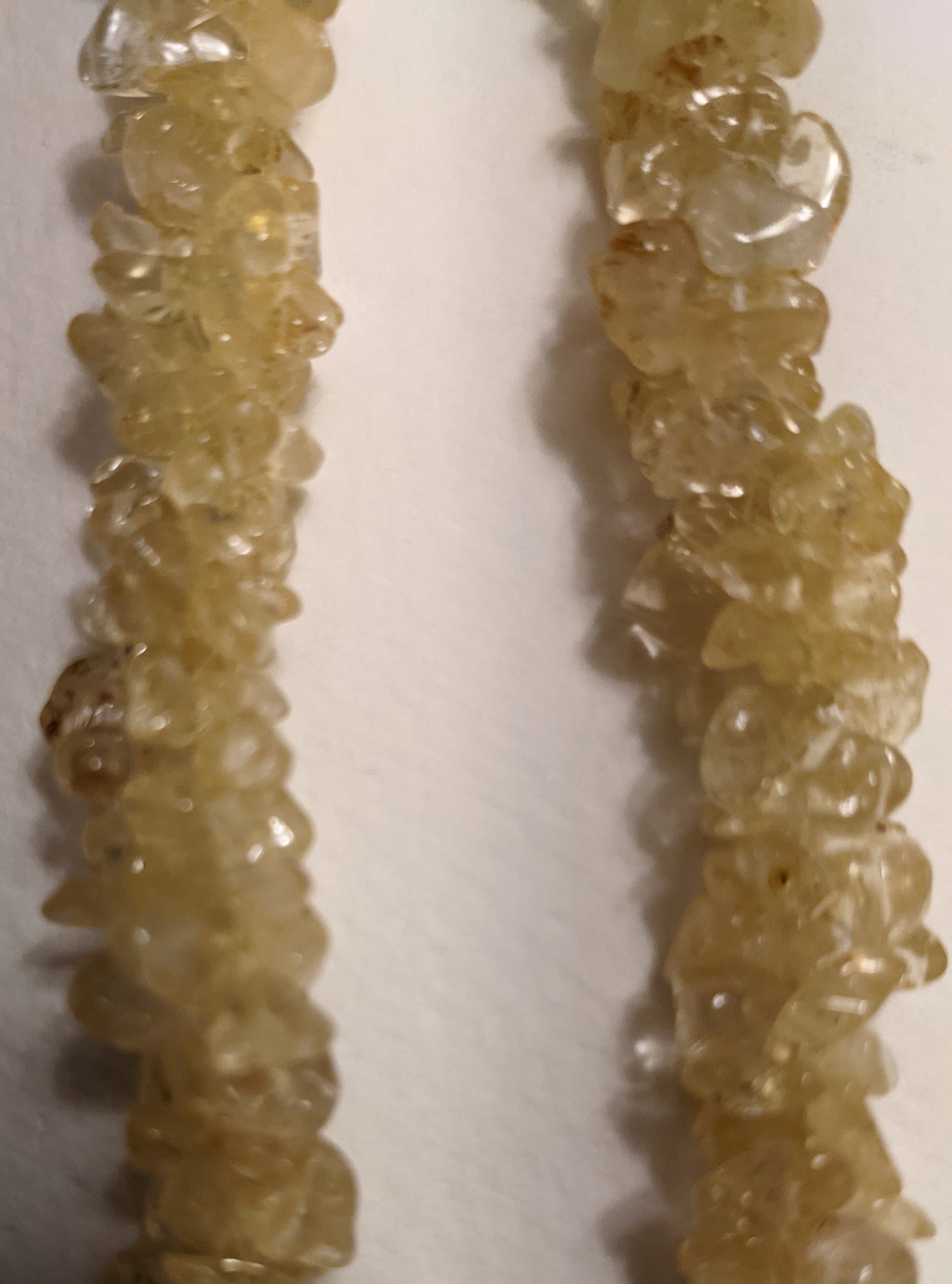 A beautiful handmade Citrine Chips Necklace featuring natural gemstone chips in vibrant yellow hues, measuring 24-25 inches in length.