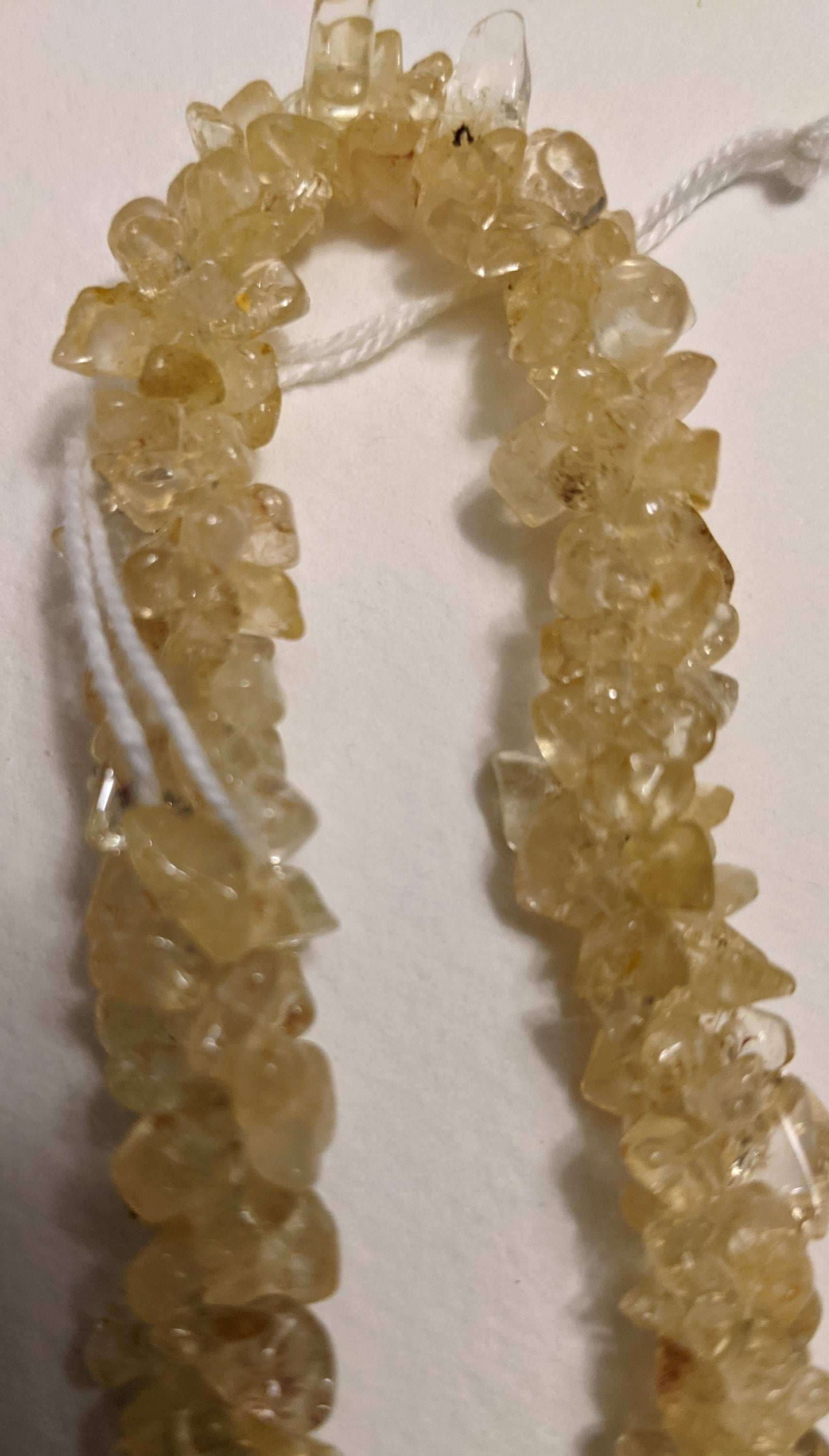 A beautiful handmade Citrine Chips Necklace featuring natural gemstone chips in vibrant yellow hues, measuring 24-25 inches in length.