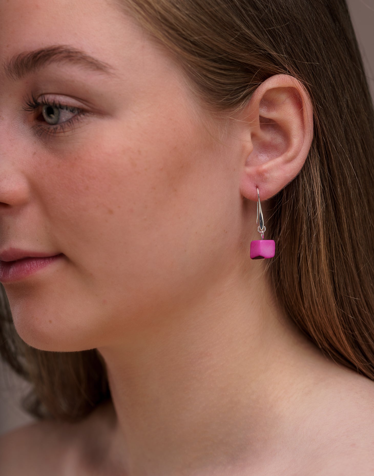 Clara Tagua Earrings featuring handmade tagua nut cubes with silver plated hooks, showcasing eco-friendly craftsmanship.