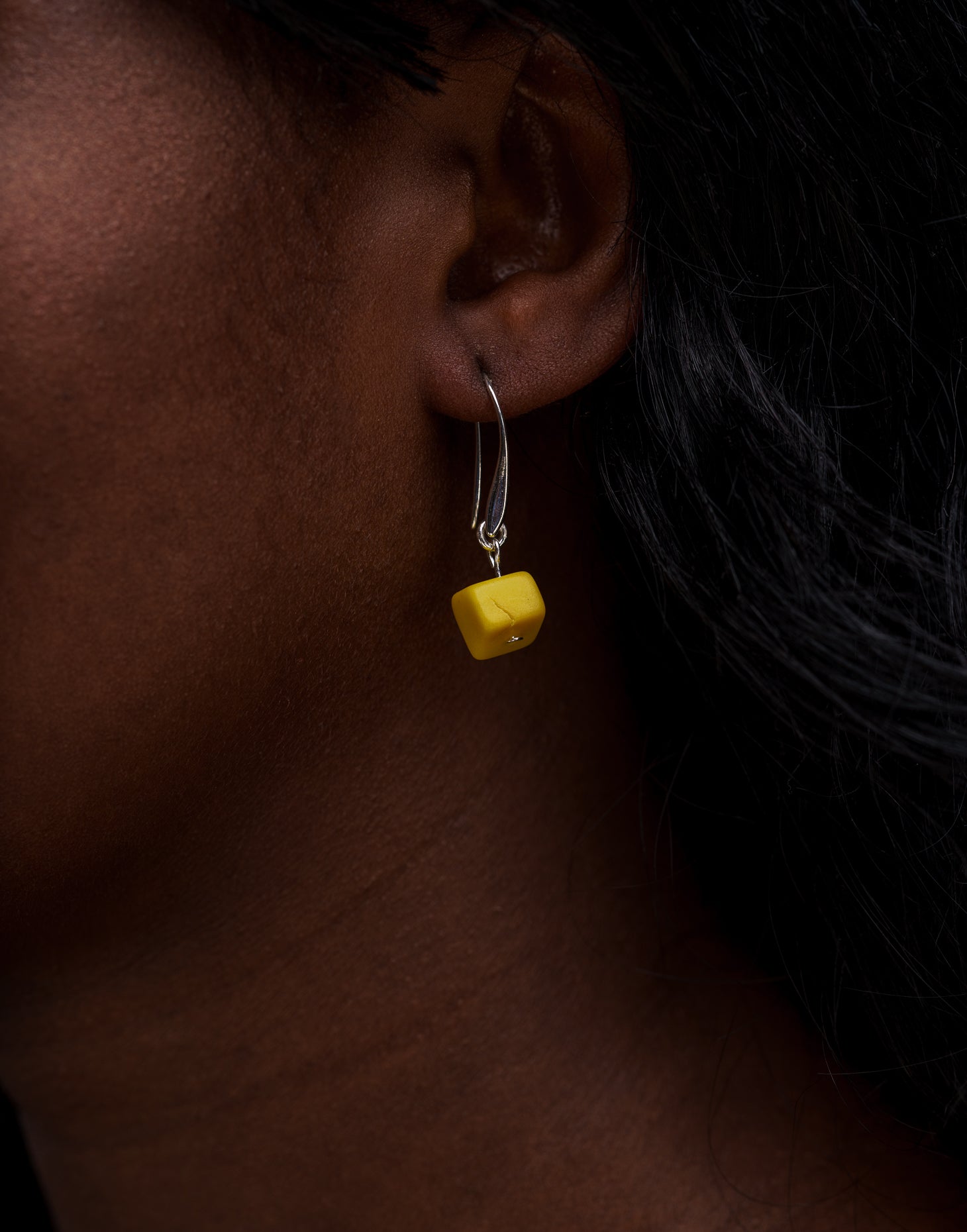 Clara Tagua Earrings featuring handmade tagua nut cubes with silver plated hooks, showcasing eco-friendly craftsmanship.