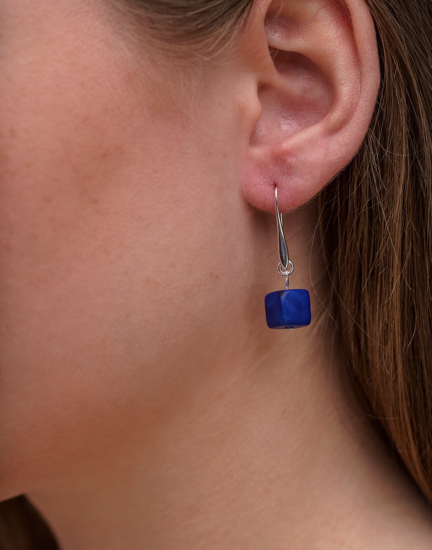 Clara Tagua Earrings featuring handmade tagua nut cubes with silver plated hooks, showcasing eco-friendly craftsmanship.