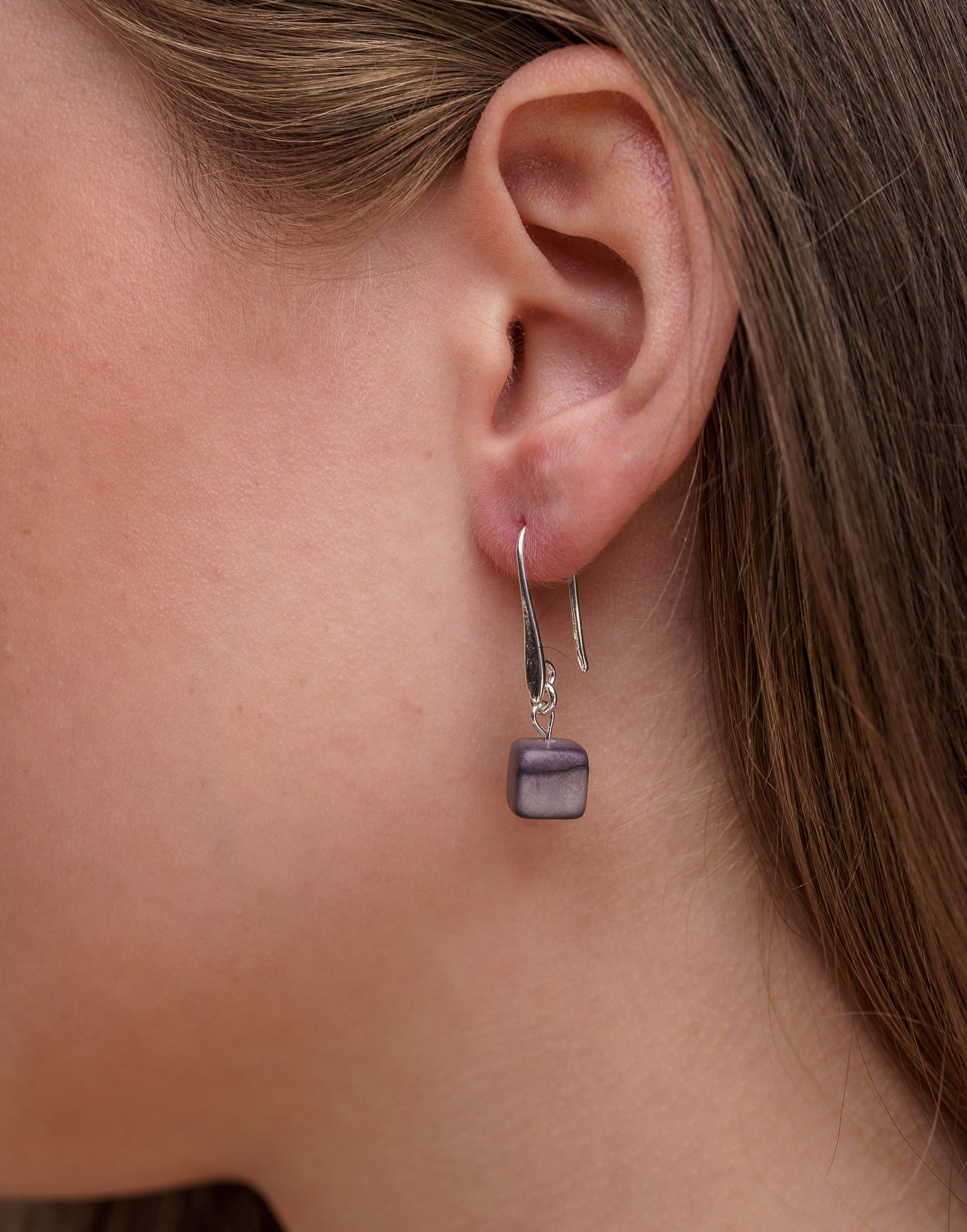 Clara Tagua Earrings featuring handmade tagua nut cubes with silver plated hooks, showcasing eco-friendly craftsmanship.