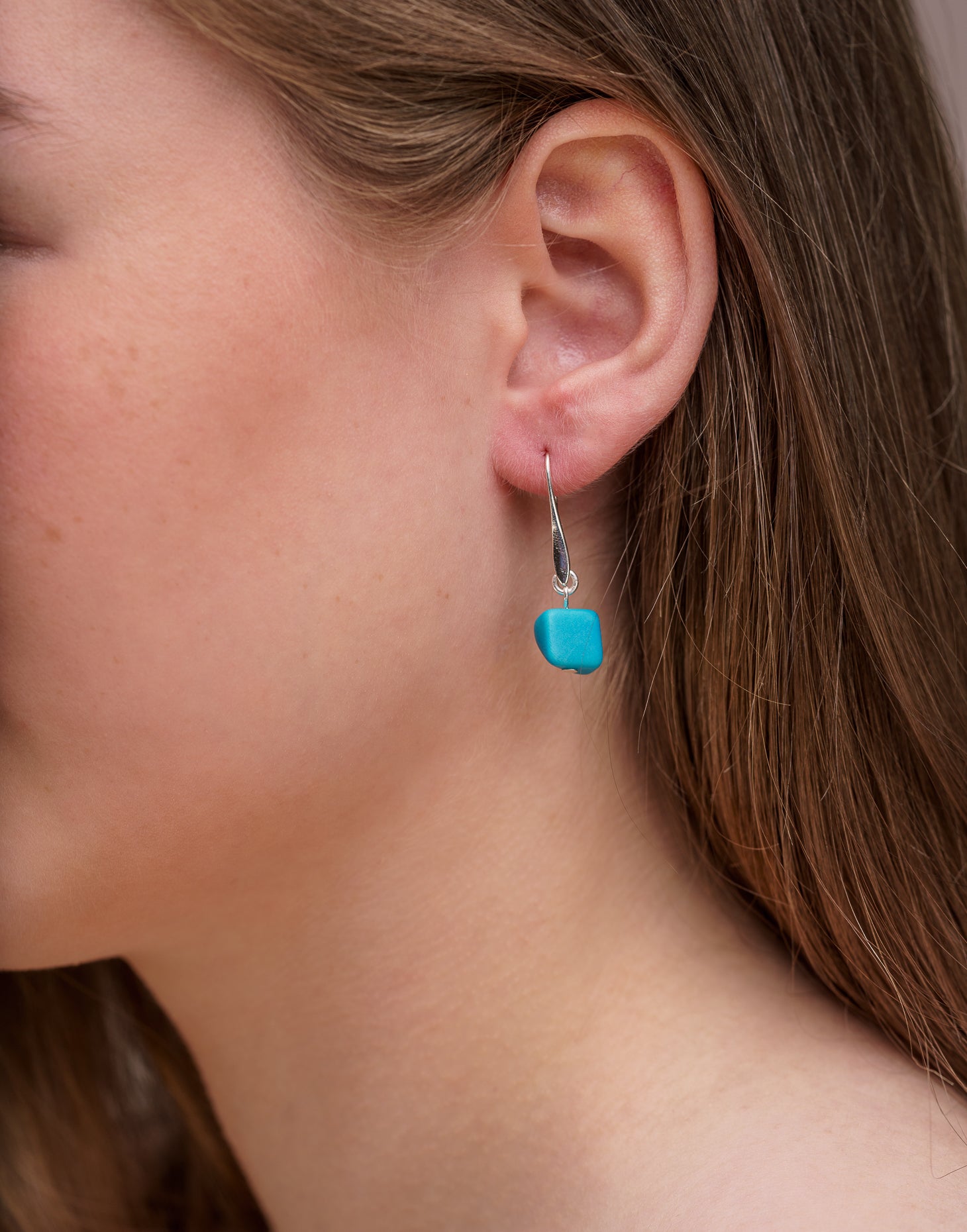 Clara Tagua Earrings featuring handmade tagua nut cubes with silver plated hooks, showcasing eco-friendly craftsmanship.