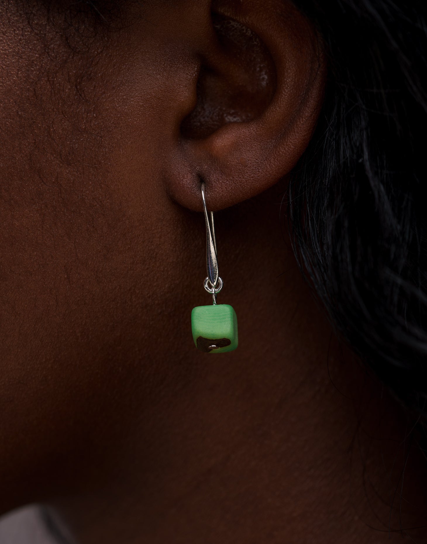 Clara Tagua Earrings featuring handmade tagua nut cubes with silver plated hooks, showcasing eco-friendly craftsmanship.